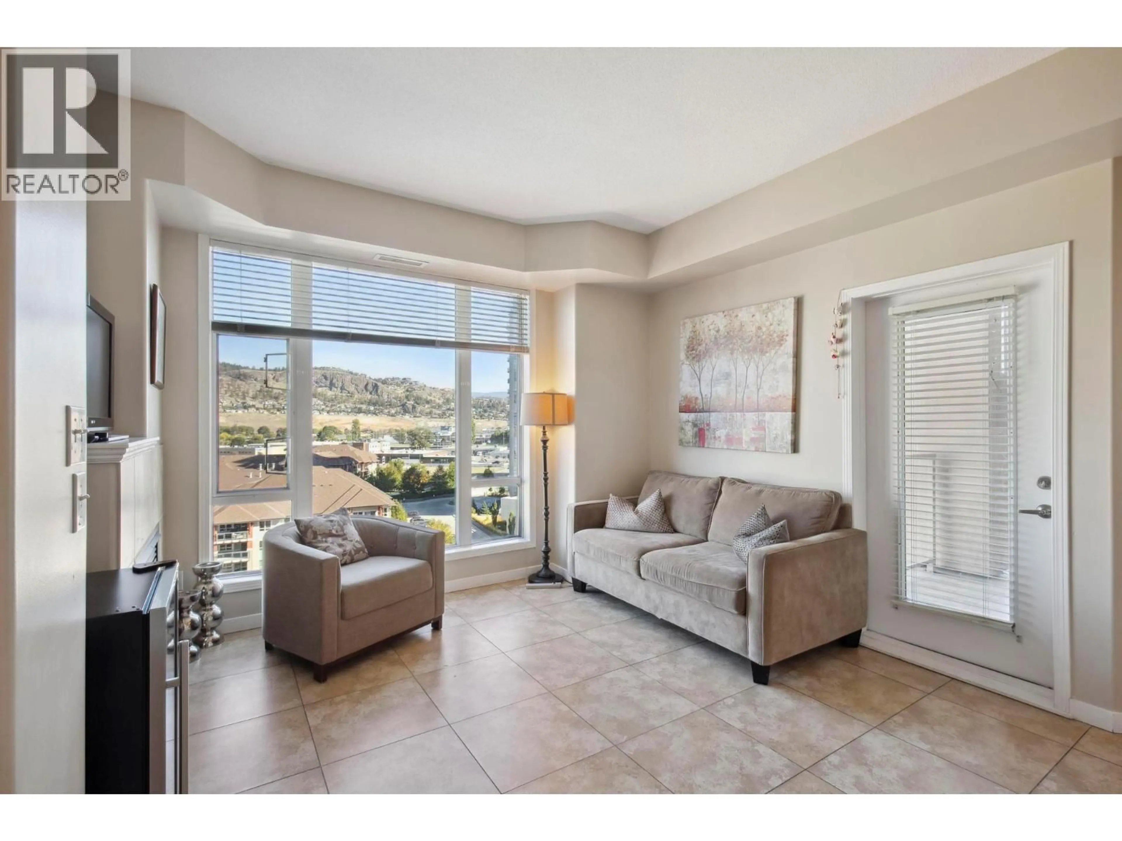 Living room with furniture, ceramic/tile floor for 904 - 1128 SUNSET DRIVE, Kelowna British Columbia V1Y9W7