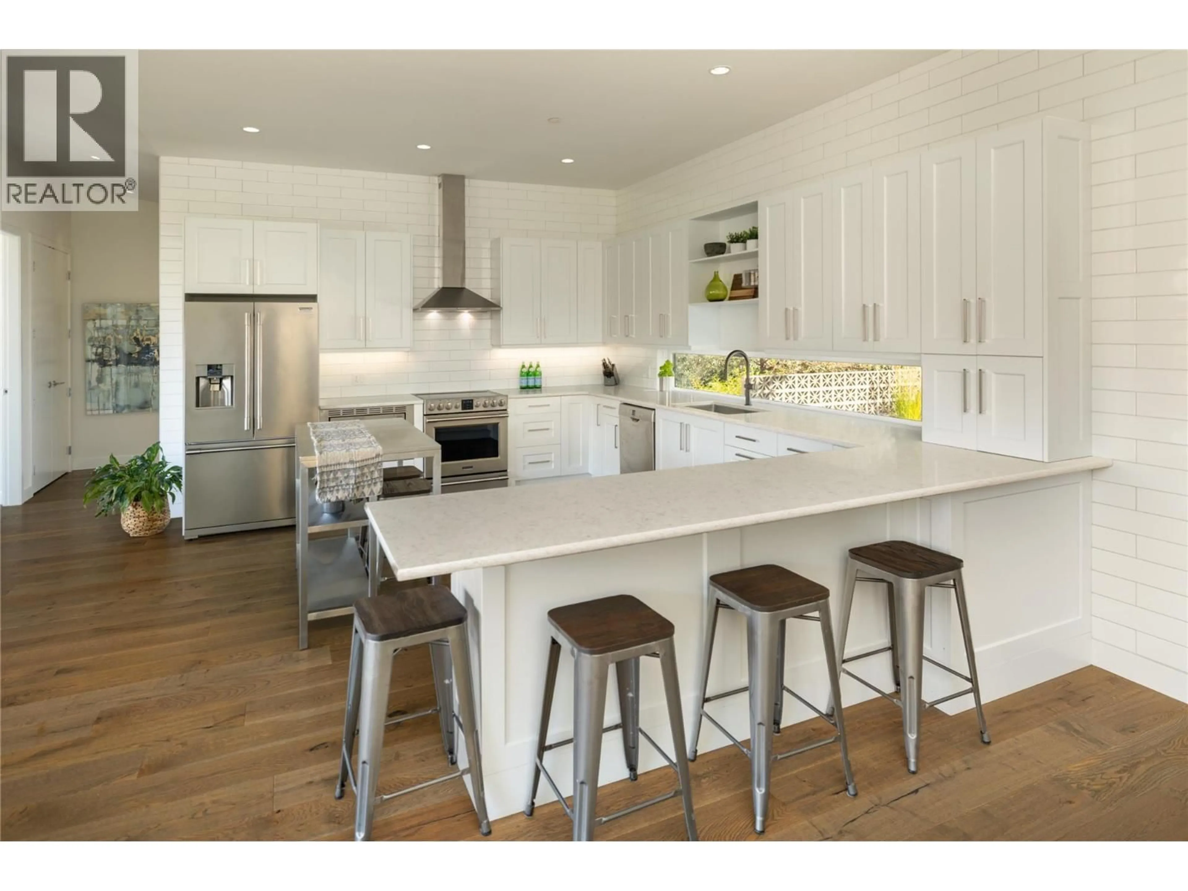 Open concept kitchen, wood/laminate floor for 2155 PALY ROAD, Kelowna British Columbia V1V2B9