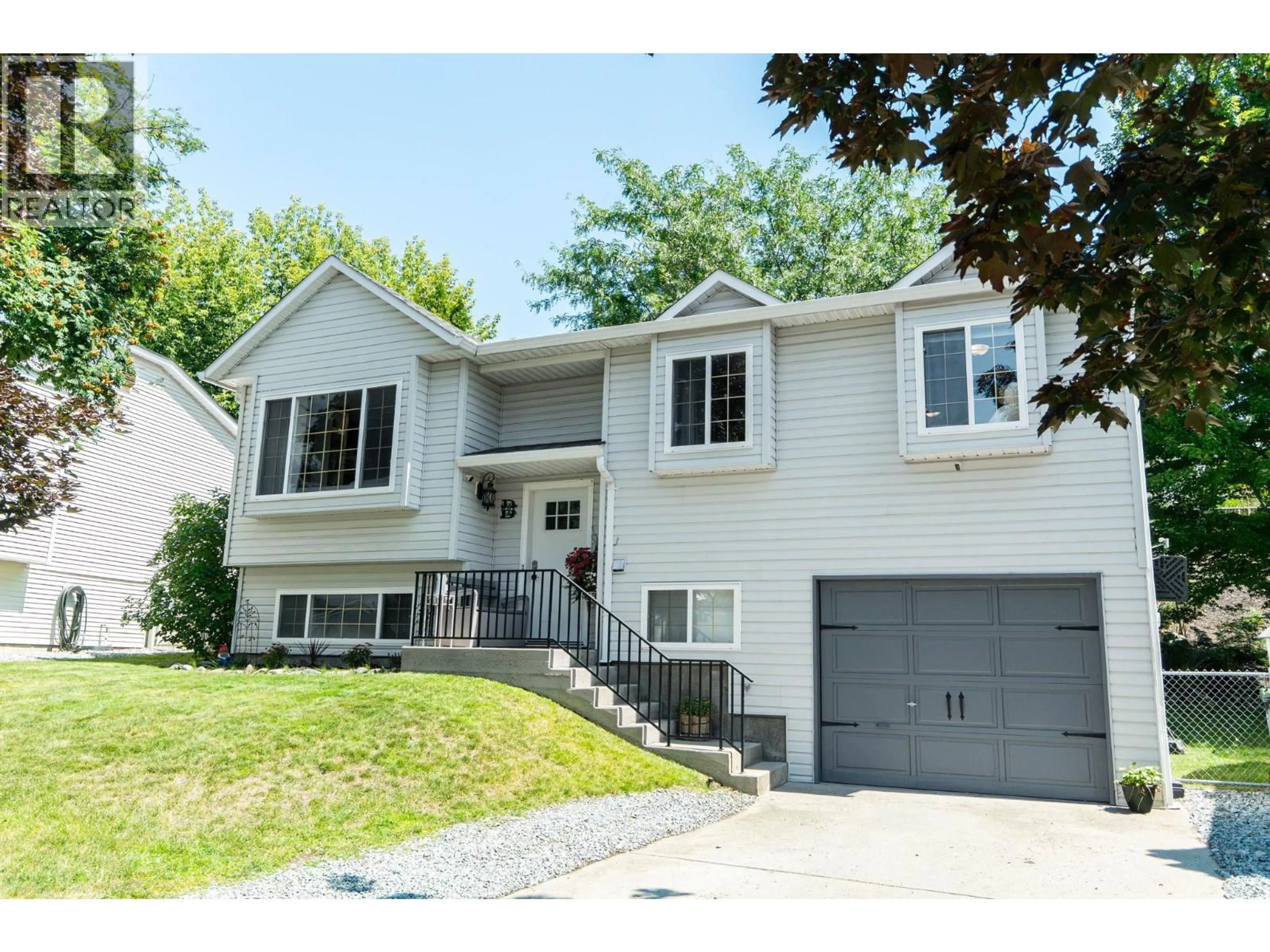 Home with vinyl exterior material, street for 24 - 6100 OLD VERNON ROAD, Ellison British Columbia V1Z7T8