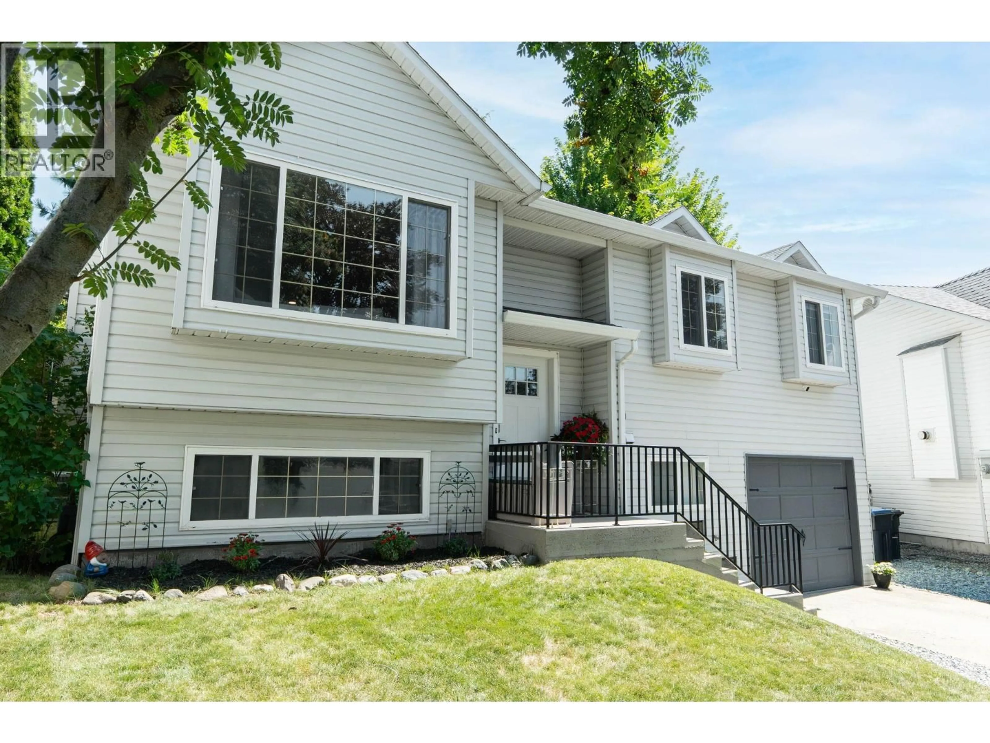 Home with vinyl exterior material, street for 24 - 6100 OLD VERNON ROAD, Ellison British Columbia V1Z7T8