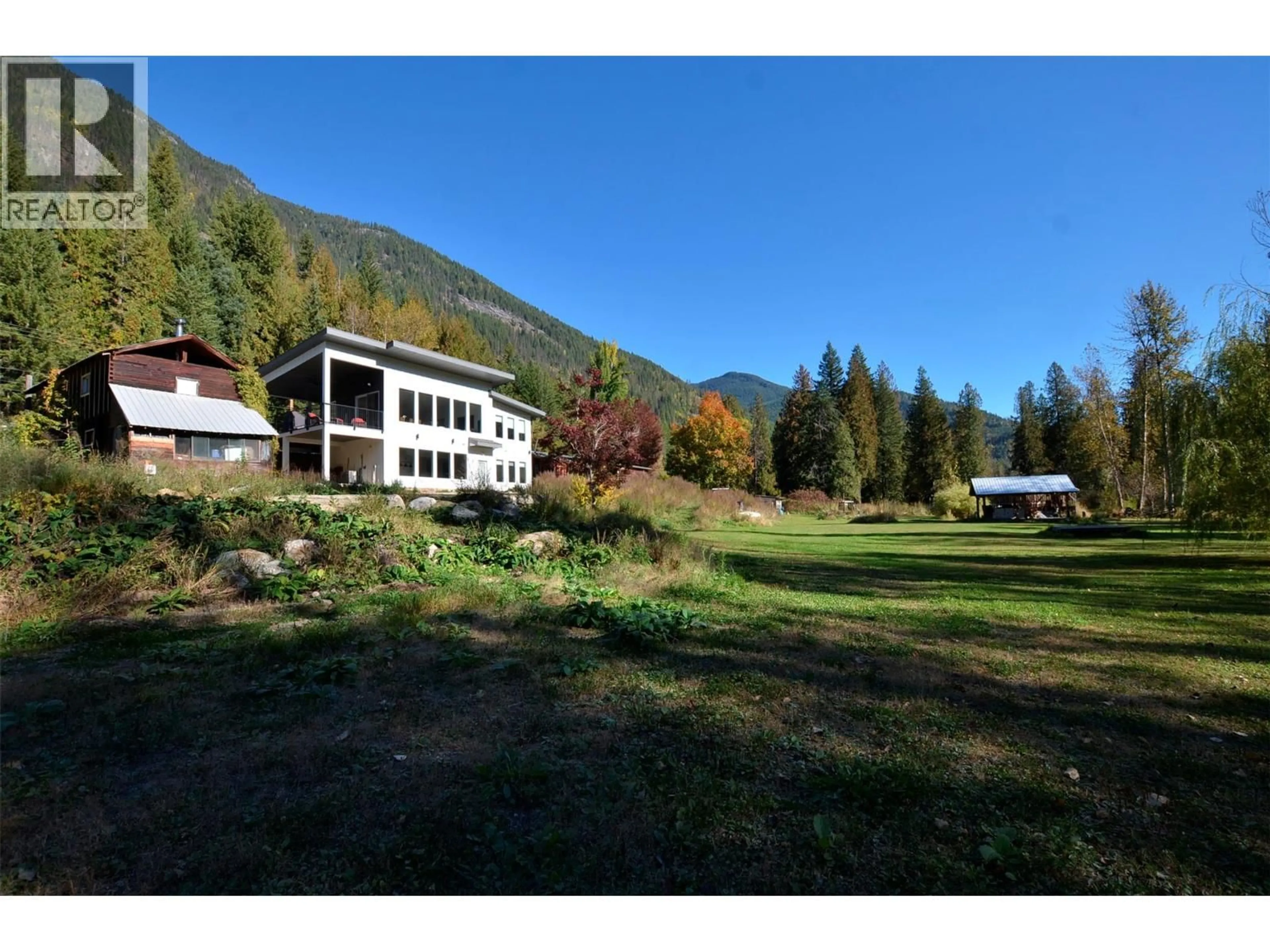 A pic from outside/outdoor area/front of a property/back of a property/a pic from drone, mountain view for 5916 FERGUSON FRONTAGE ROAD, Malakwa British Columbia V0E2J0