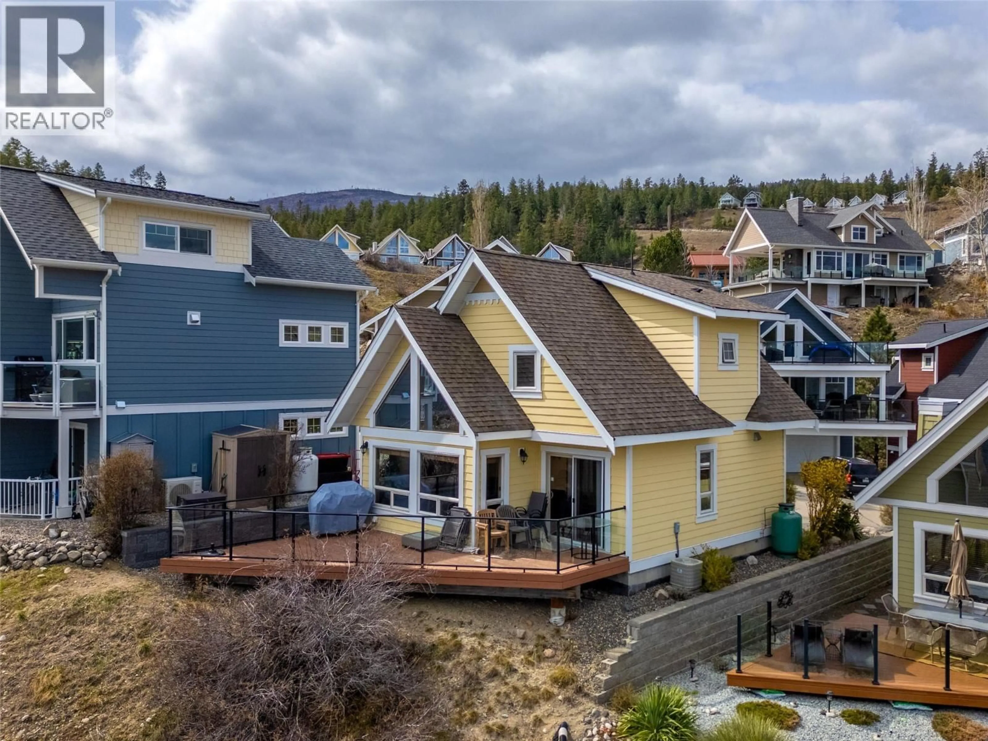 A pic from outside/outdoor area/front of a property/back of a property/a pic from drone, mountain view for 6774 LA PALMA LOOP, Kelowna British Columbia V1Z3R8