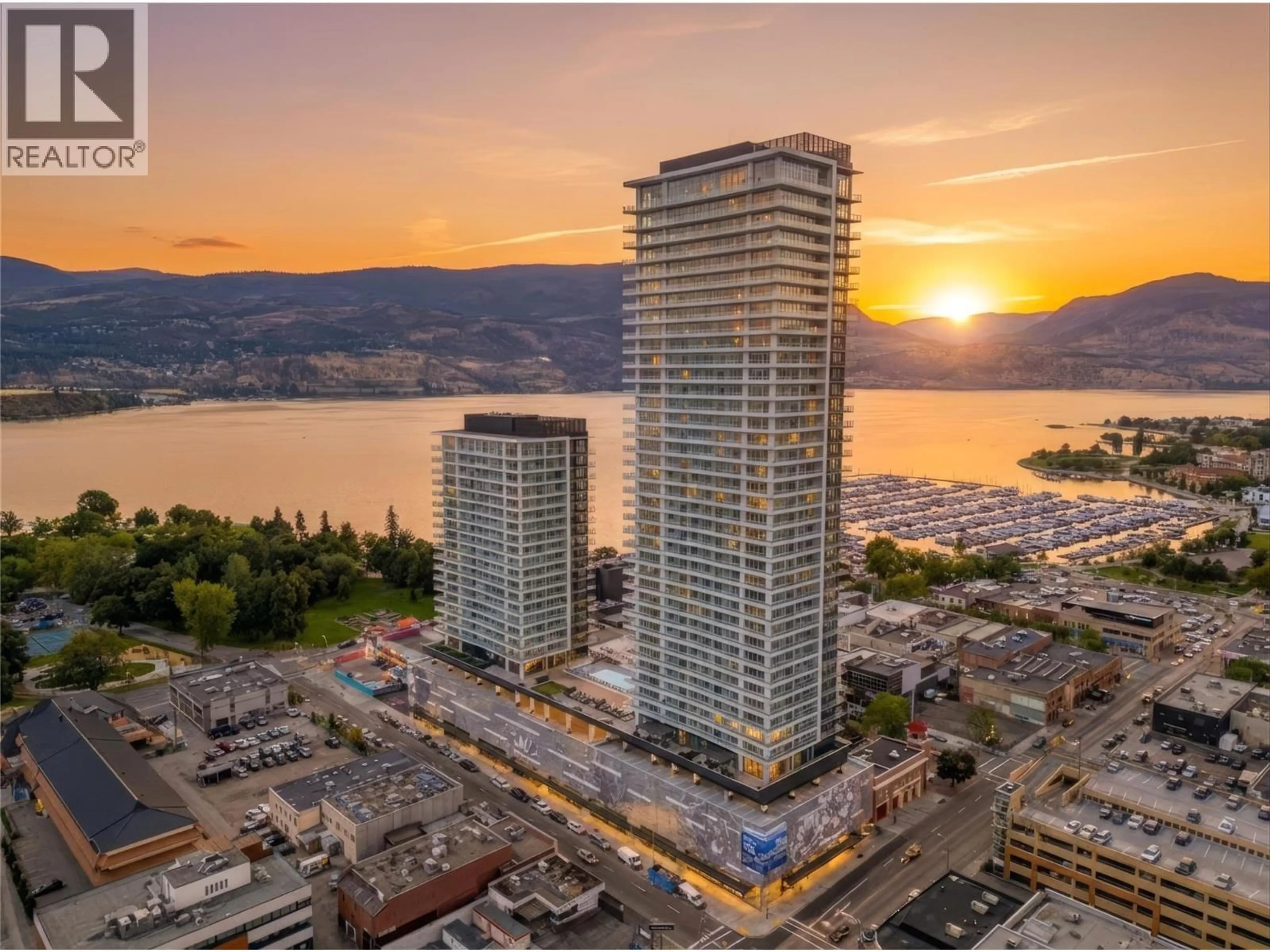 A pic from outside/outdoor area/front of a property/back of a property/a pic from drone, water/lake/river/ocean view for 1403 - 238 LEON AVENUE, Kelowna British Columbia V1Y6H9