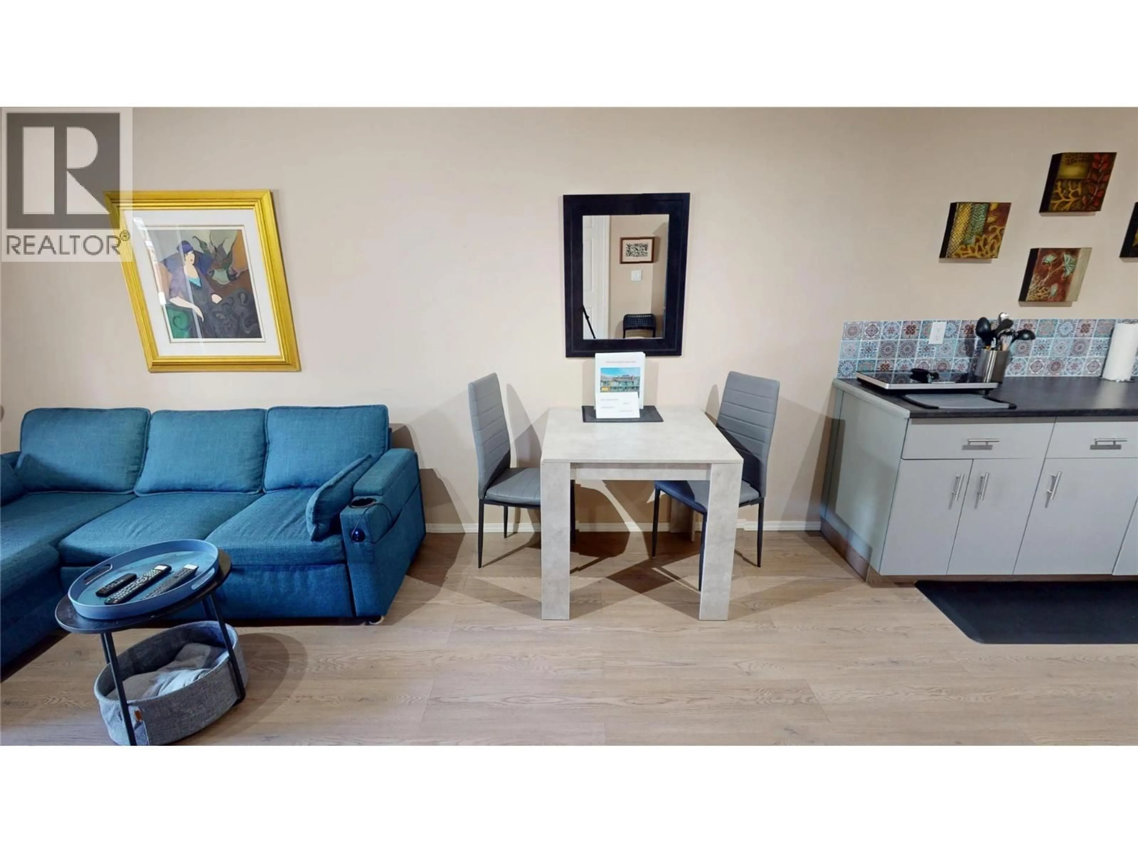 Living room with furniture, wood/laminate floor for 701 - 5155 FAIRWAY DRIVE, Fairmont Hot Springs British Columbia V0B1L1