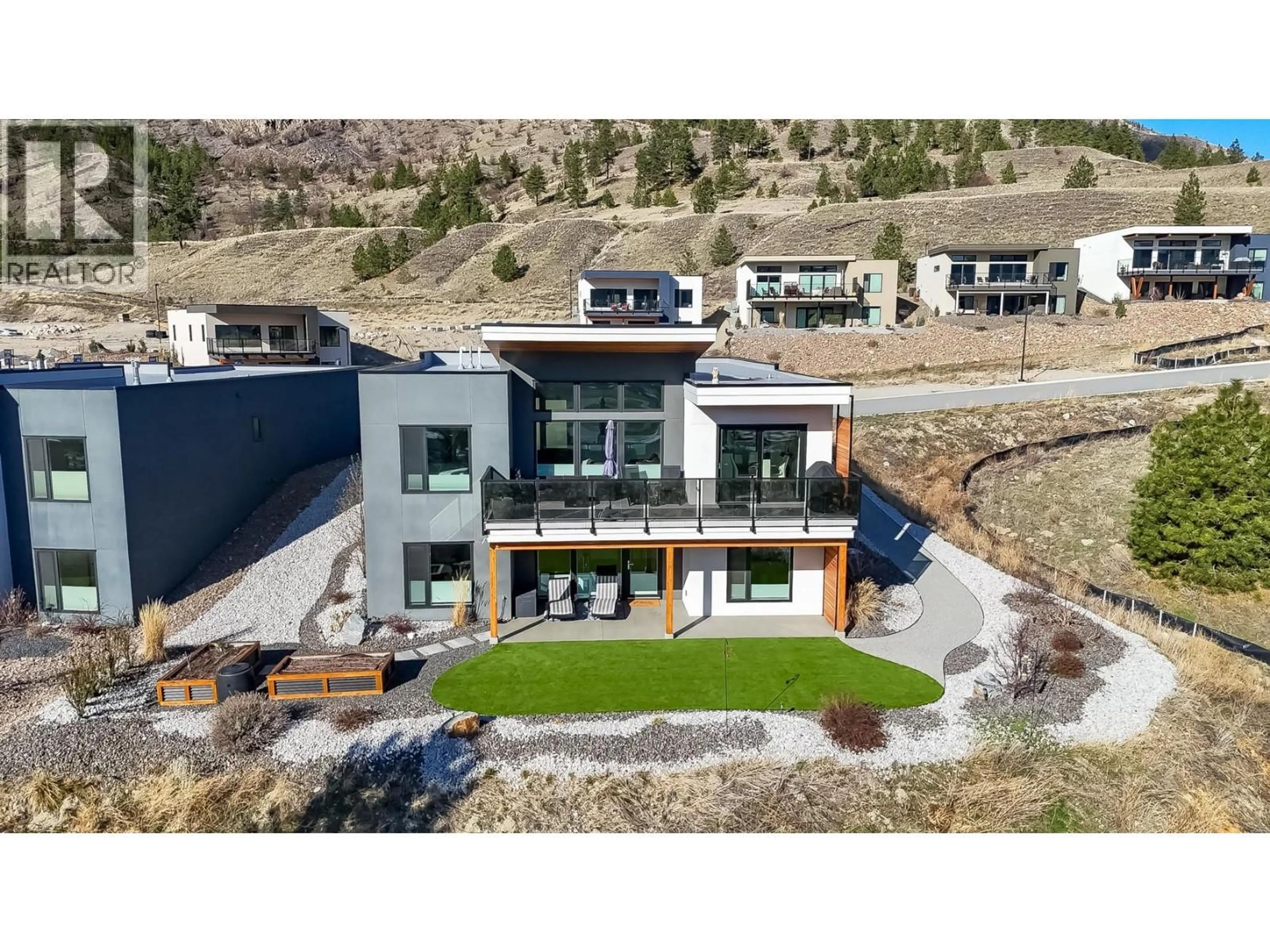 A pic from outside/outdoor area/front of a property/back of a property/a pic from drone, mountain view for 104 SKAHA BENCH WAY, Penticton British Columbia V2A0G8