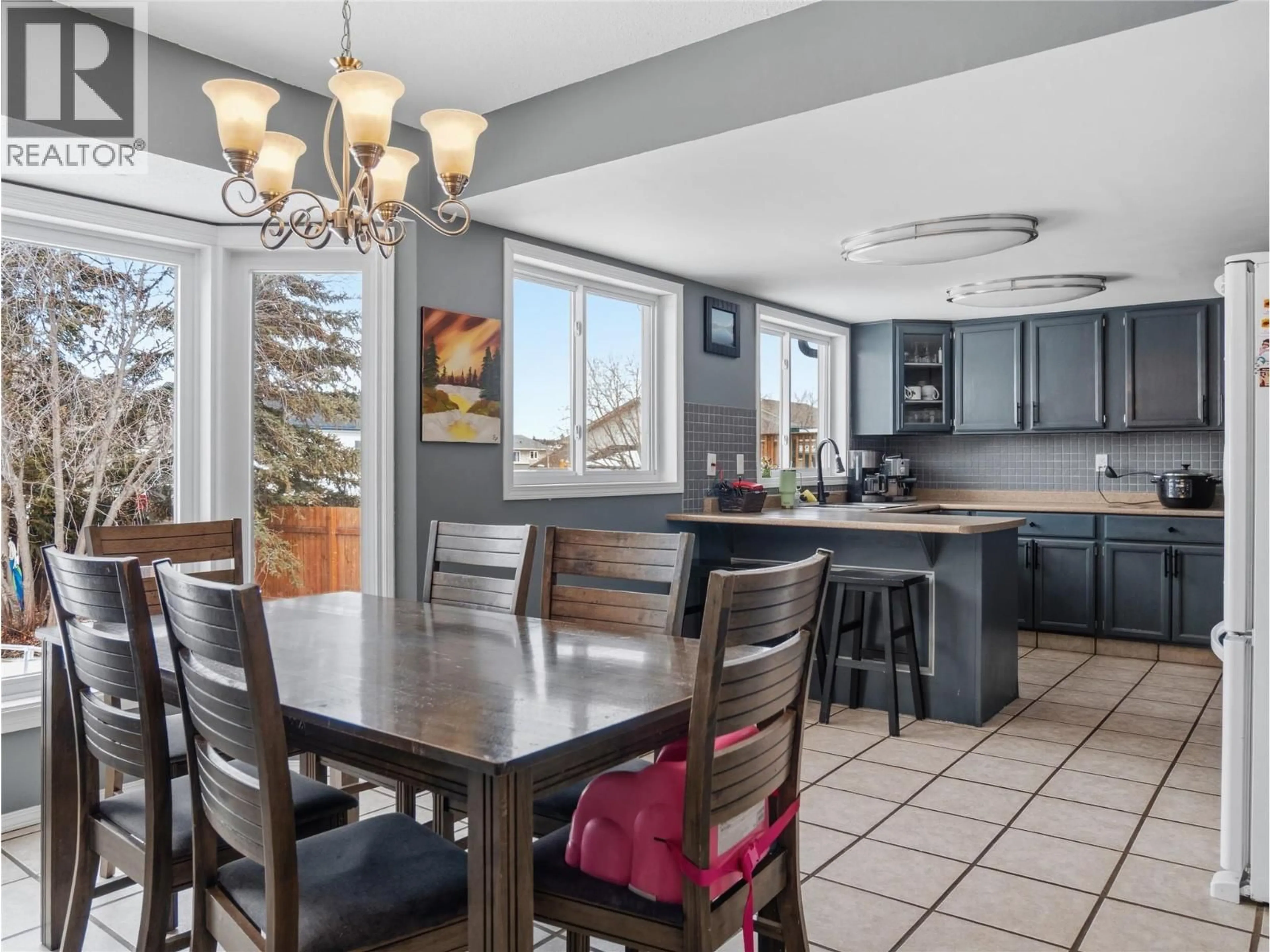 Open concept kitchen, ceramic/tile floor for 10718 CYPRUS COURT, Dawson Creek British Columbia V1G2N4
