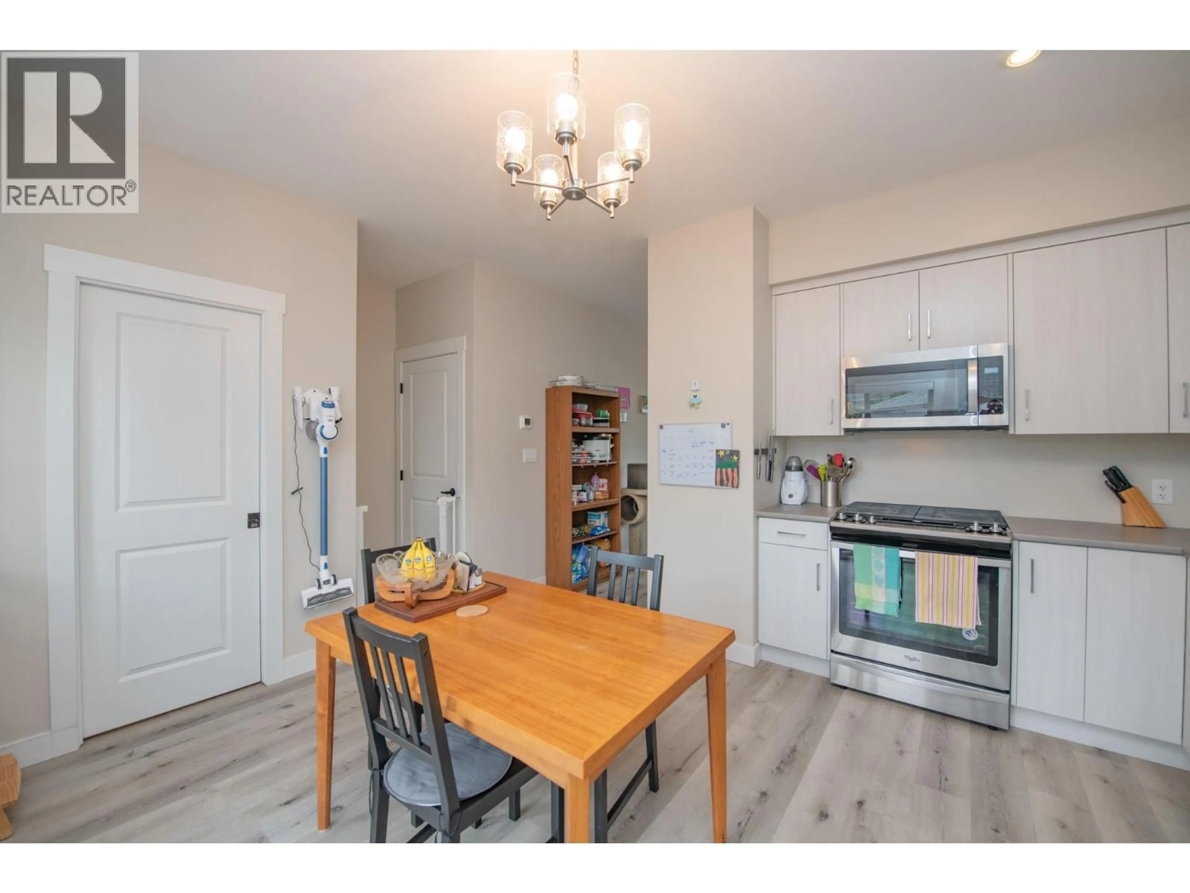 Open concept kitchen, wood/laminate floor for 103 - 4002 30 AVENUE, Vernon British Columbia V1T2G3