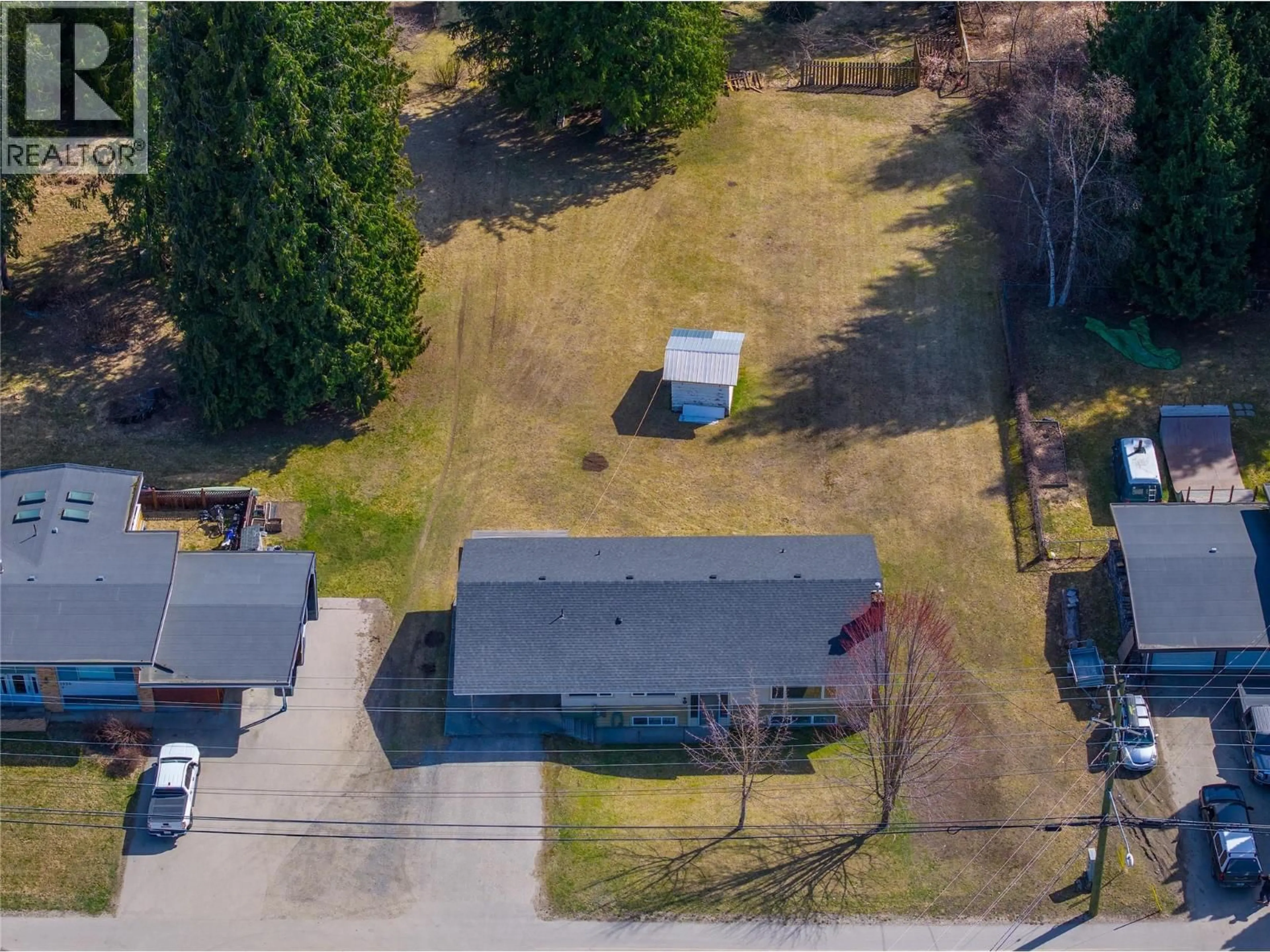 A pic from outside/outdoor area/front of a property/back of a property/a pic from drone, street for 1956 AIRPORT WAY, Revelstoke British Columbia V0E2S1