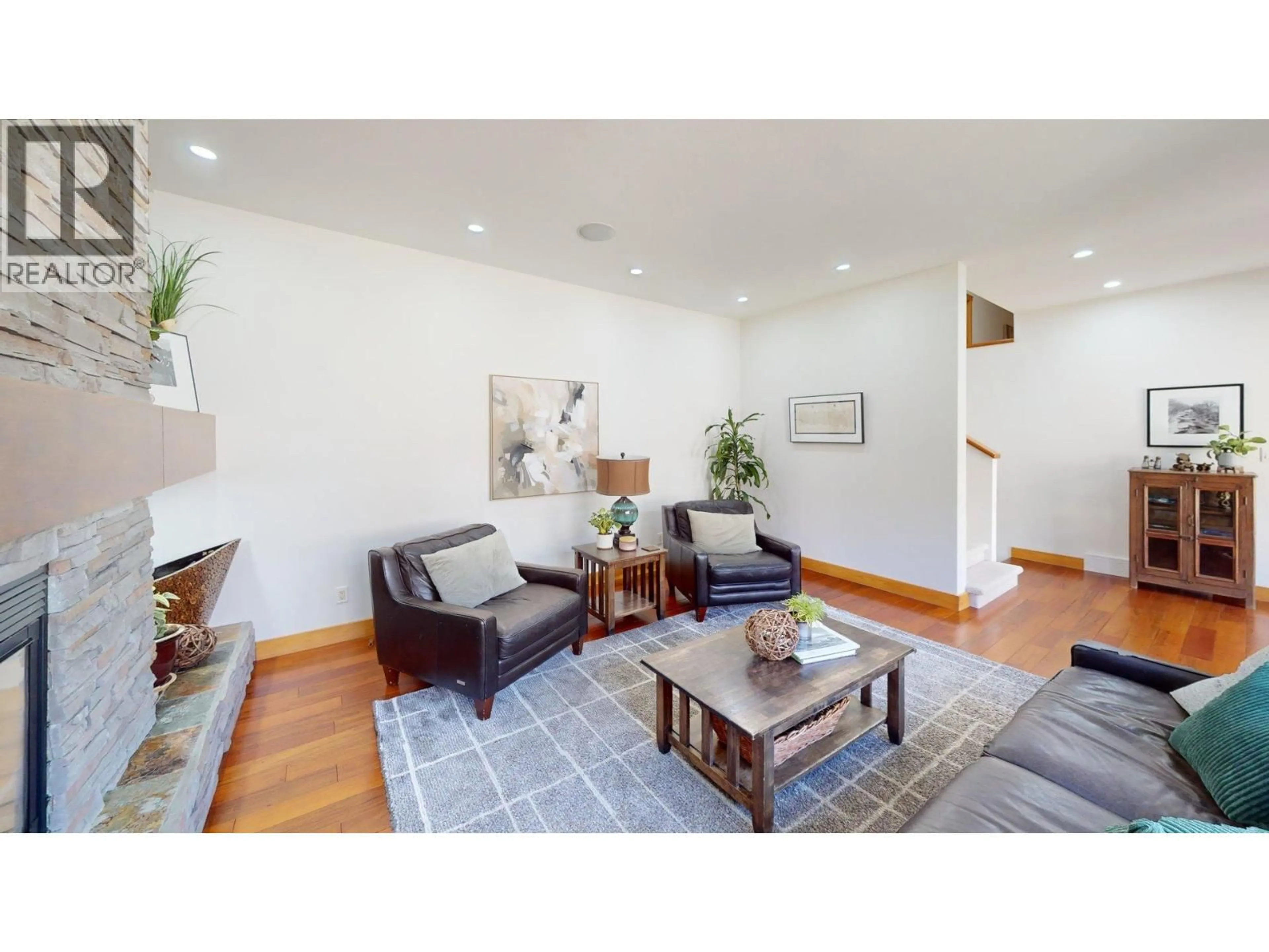 Living room with furniture, wood/laminate floor for 2455 COLIN CRESCENT, Trail British Columbia V1R4T4