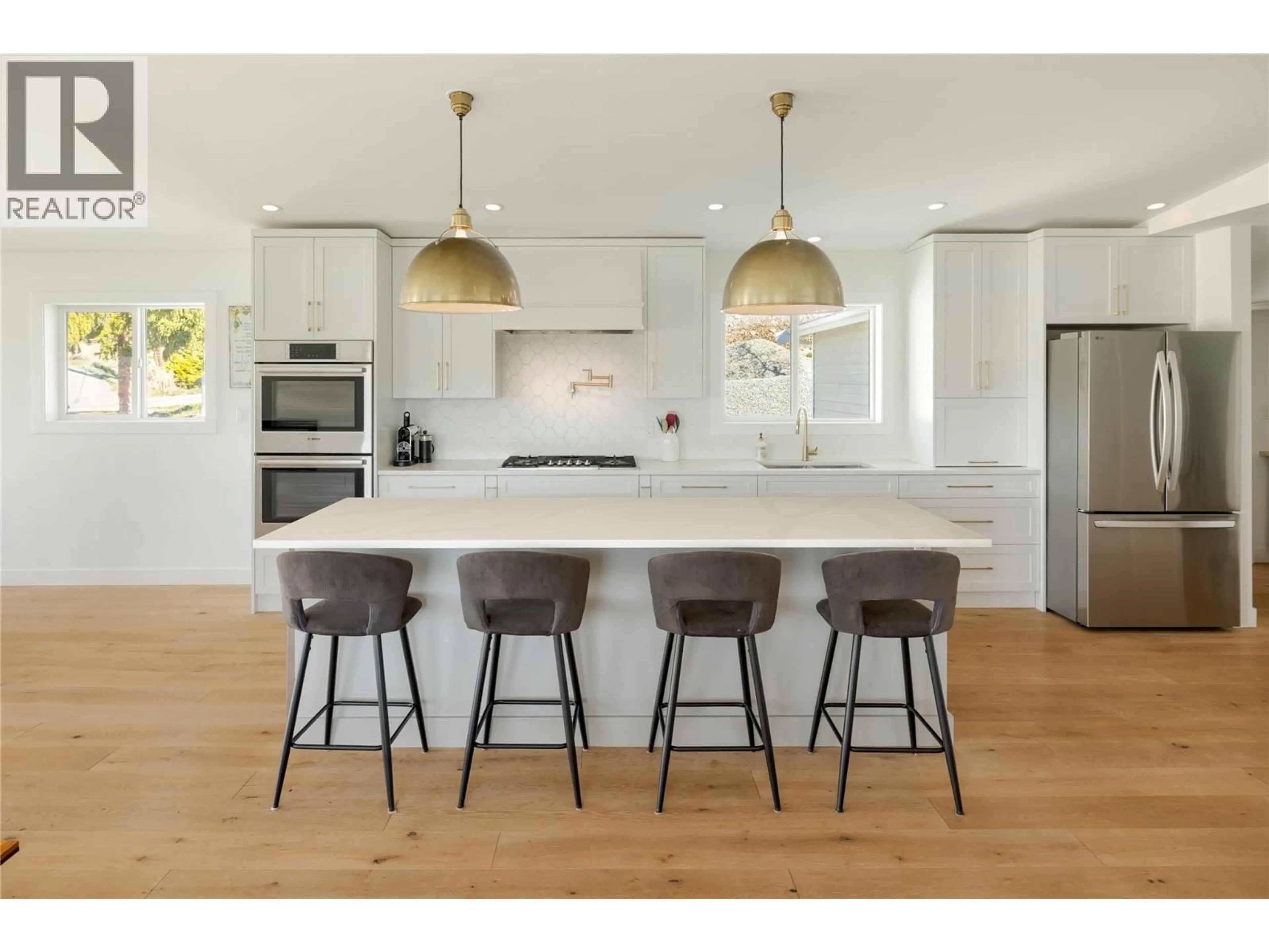 Open concept kitchen, wood/laminate floor for 10942 RUSSELL ROAD, Lake Country British Columbia V4V1W9