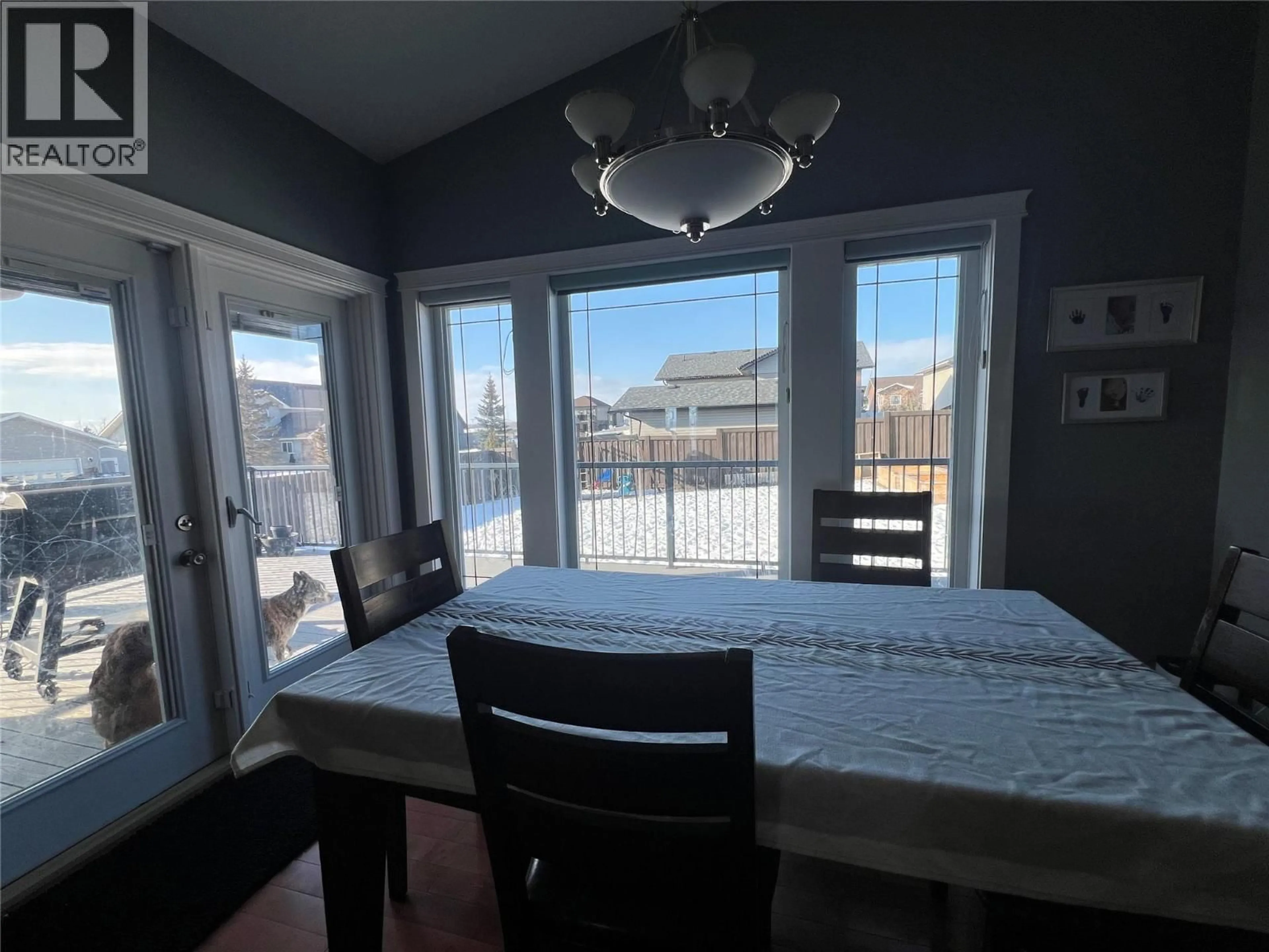 Dining room, wood/laminate floor for 1844 88 AVENUE, Dawson Creek British Columbia V1G0A6