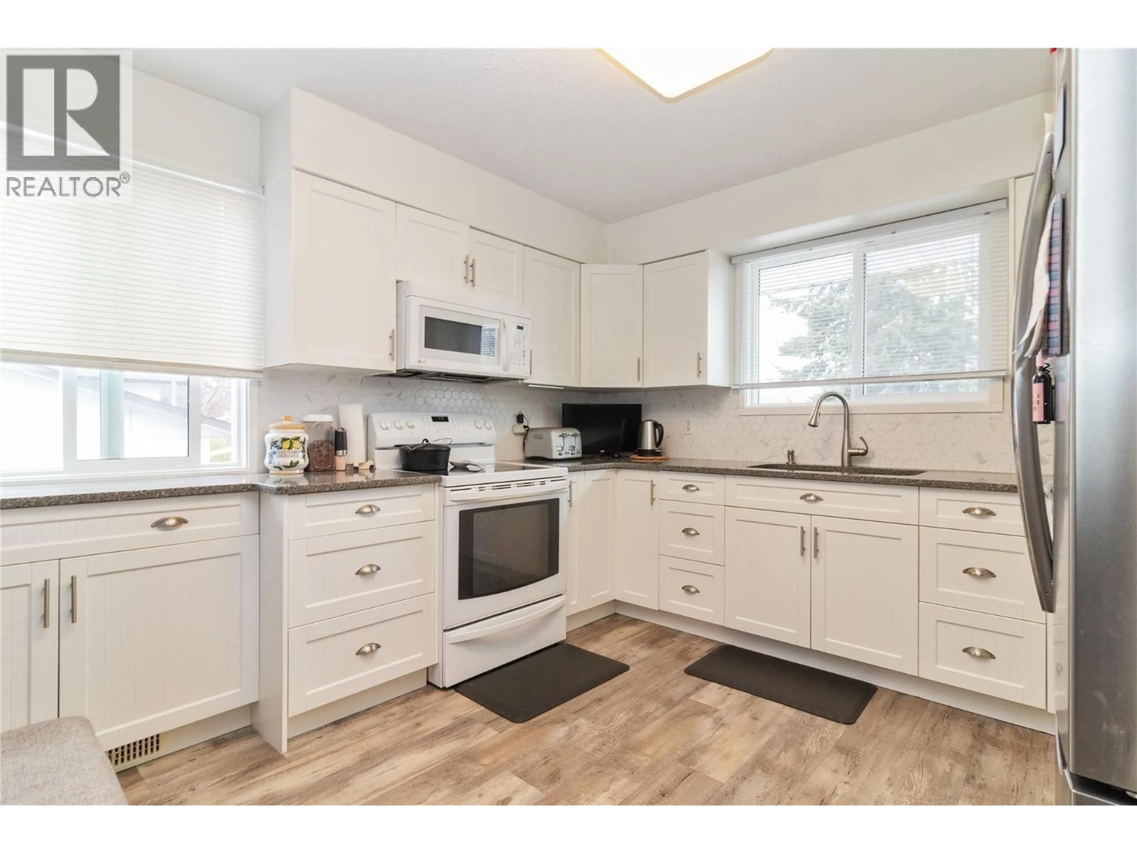 Standard kitchen, wood/laminate floor for 410 MADSEN ROAD, Kelowna British Columbia V1X2C2