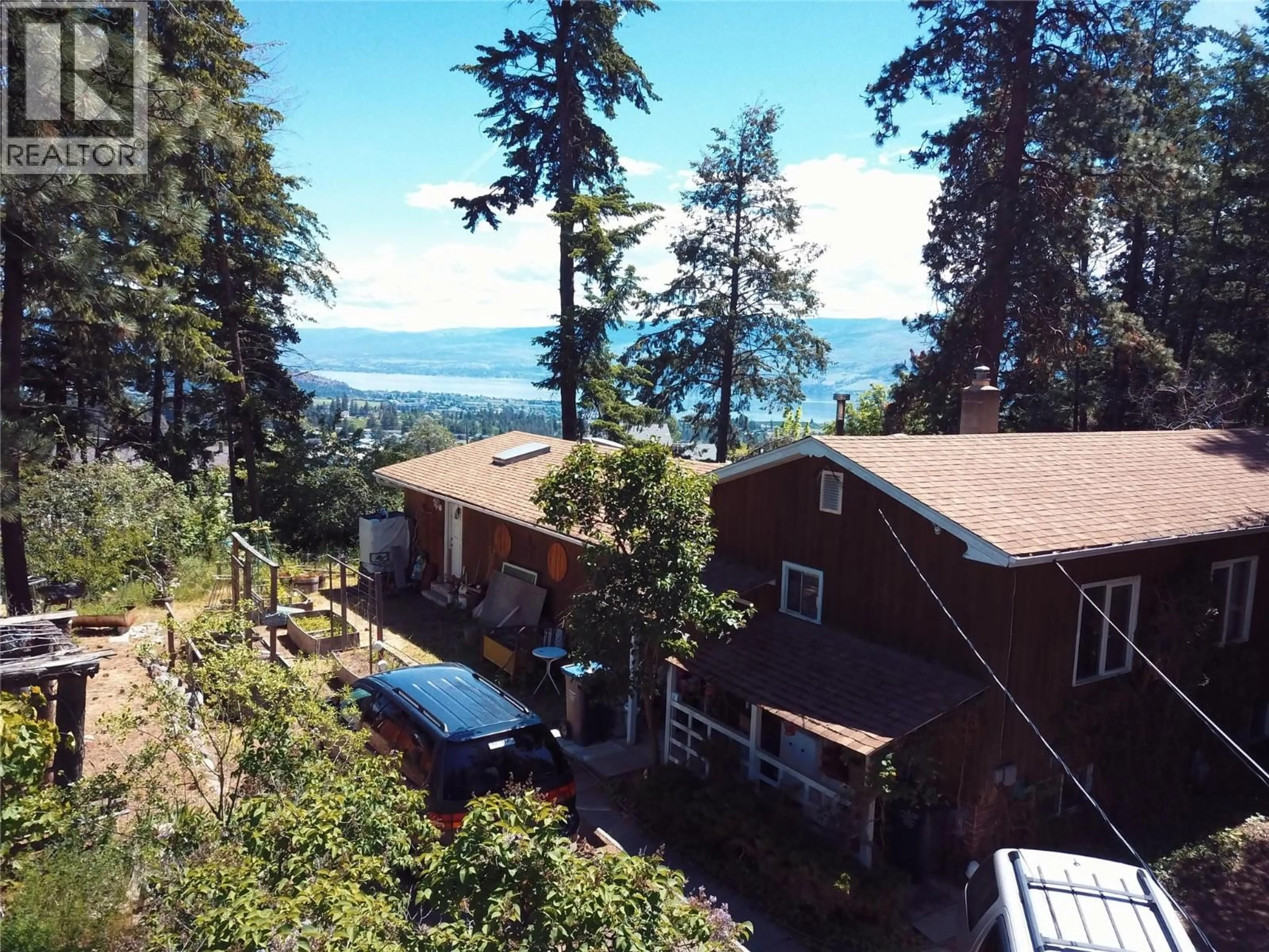 A pic from outside/outdoor area/front of a property/back of a property/a pic from drone, water/lake/river/ocean view for 3021 MCIVER ROAD, West Kelowna British Columbia V4T1C4