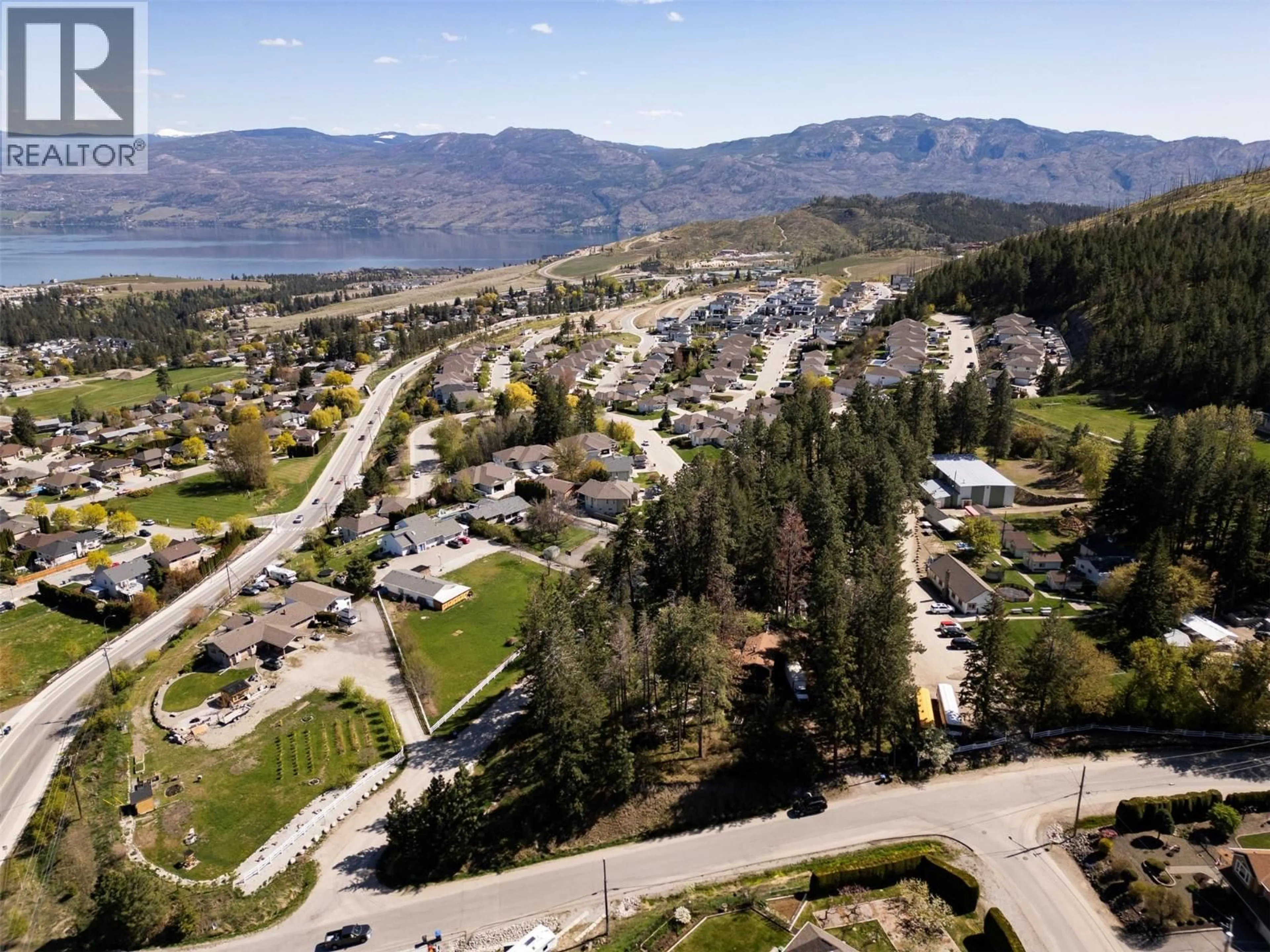 A pic from outside/outdoor area/front of a property/back of a property/a pic from drone, mountain view for 3021 MCIVER ROAD, West Kelowna British Columbia V4T1C4