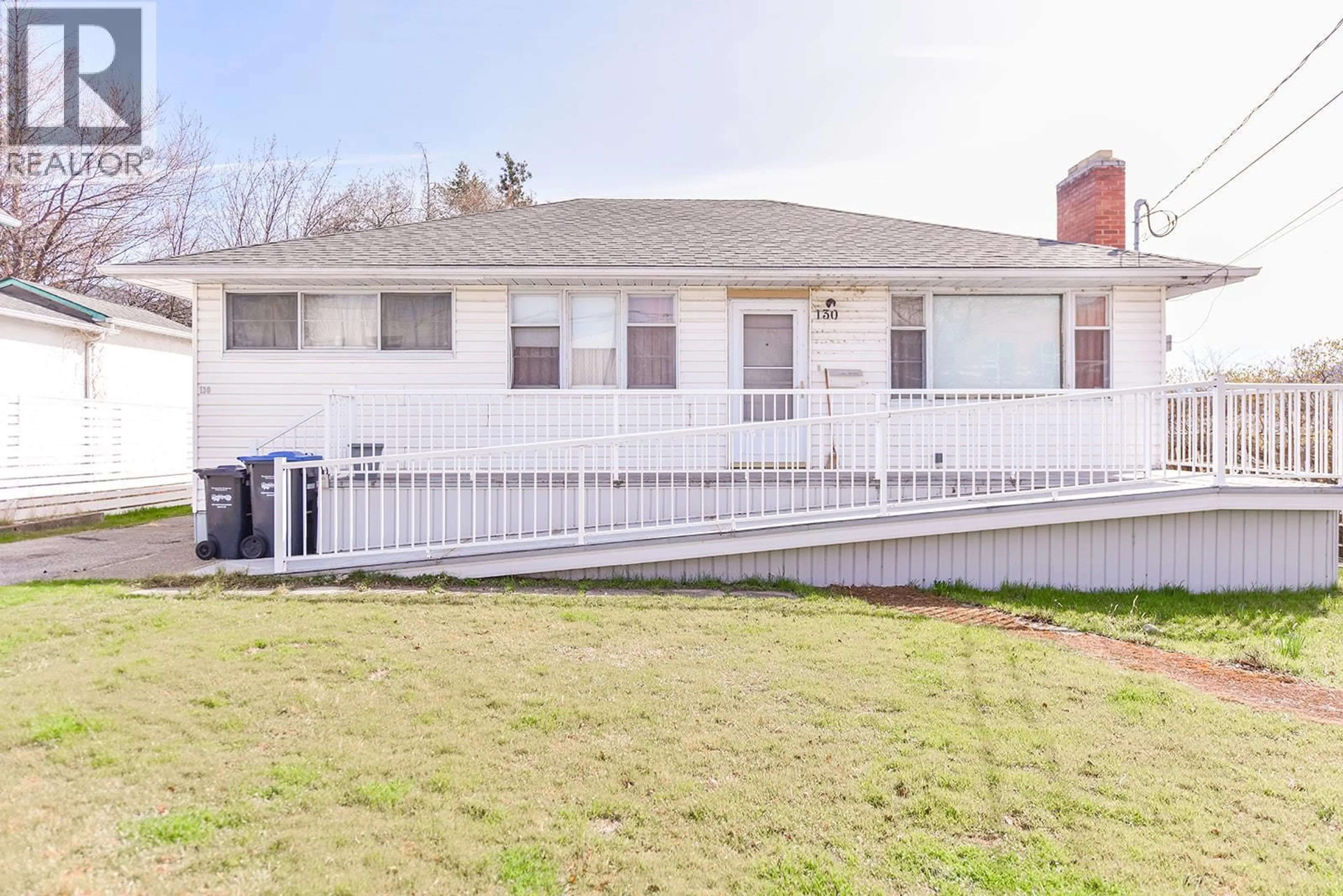 A pic from outside/outdoor area/front of a property/back of a property/a pic from drone, street for 130 JERMYN AVENUE, Penticton British Columbia V2A2E1