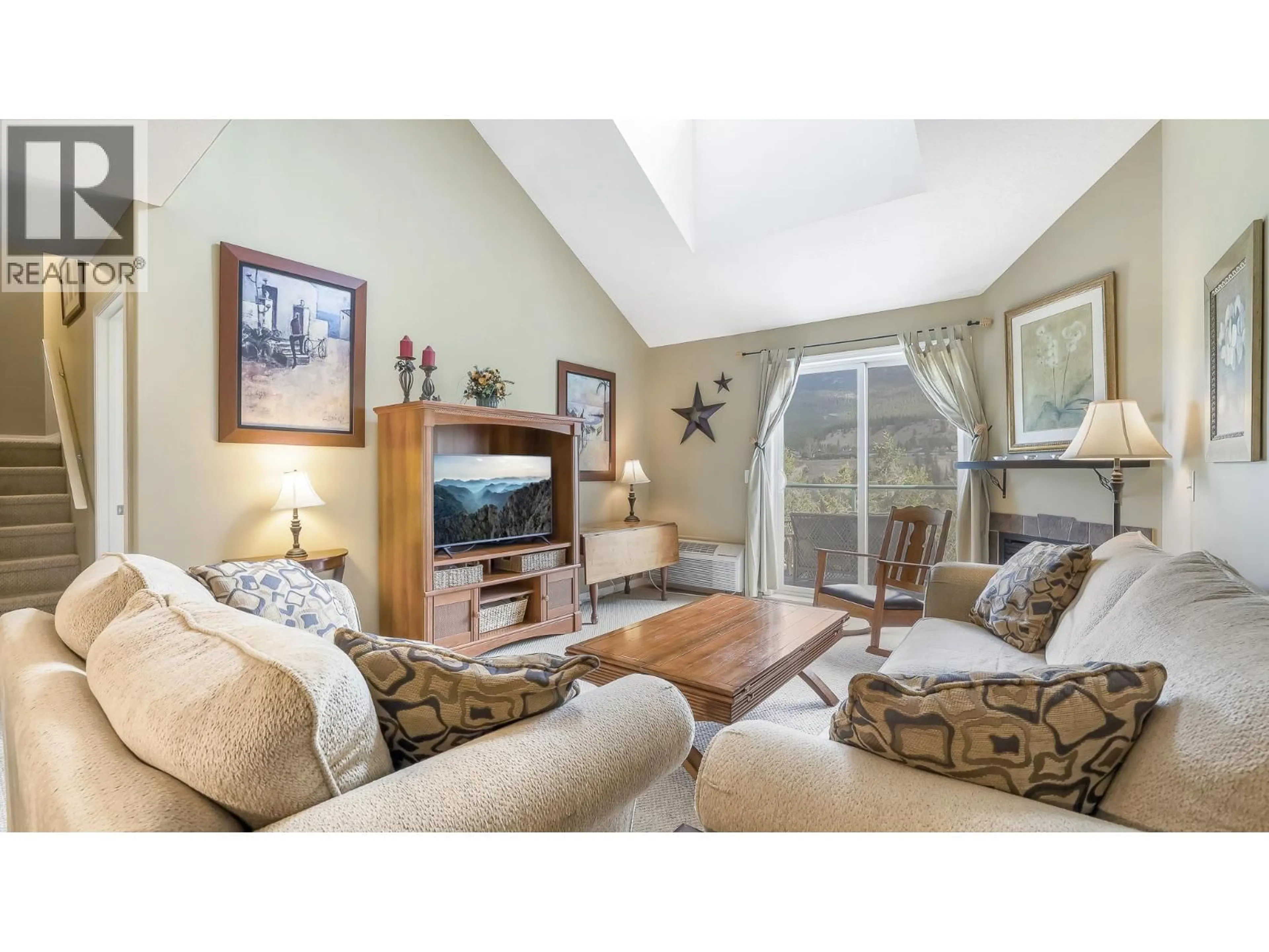 Living room with furniture, wood/laminate floor for 314 - 4765 FORSTERS LANDING ROAD, Radium Hot Springs British Columbia V0A1M0