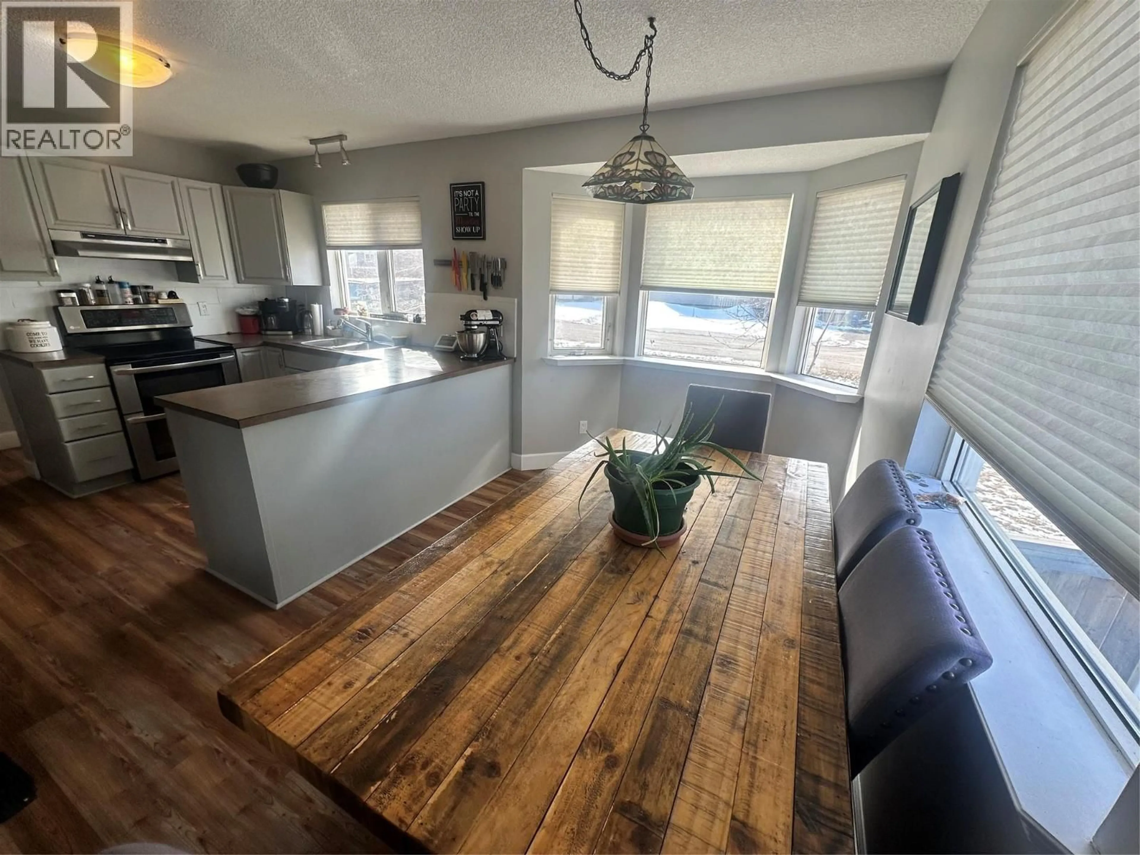 Open concept kitchen, wood/laminate floor for 4112 52A PLACE NORTHEAST, Chetwynd British Columbia V0C1J0