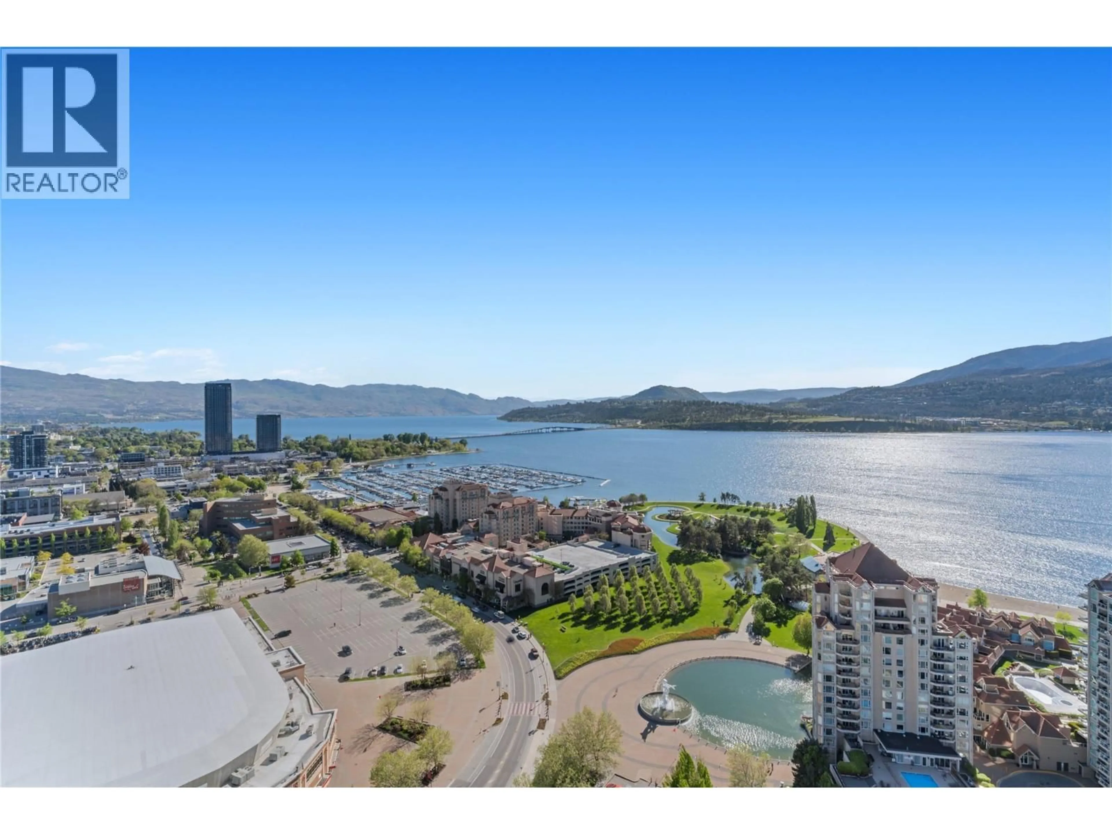 A pic from outside/outdoor area/front of a property/back of a property/a pic from drone, water/lake/river/ocean view for 2802 - 1181 SUNSET DRIVE, Kelowna British Columbia V1Y0L4