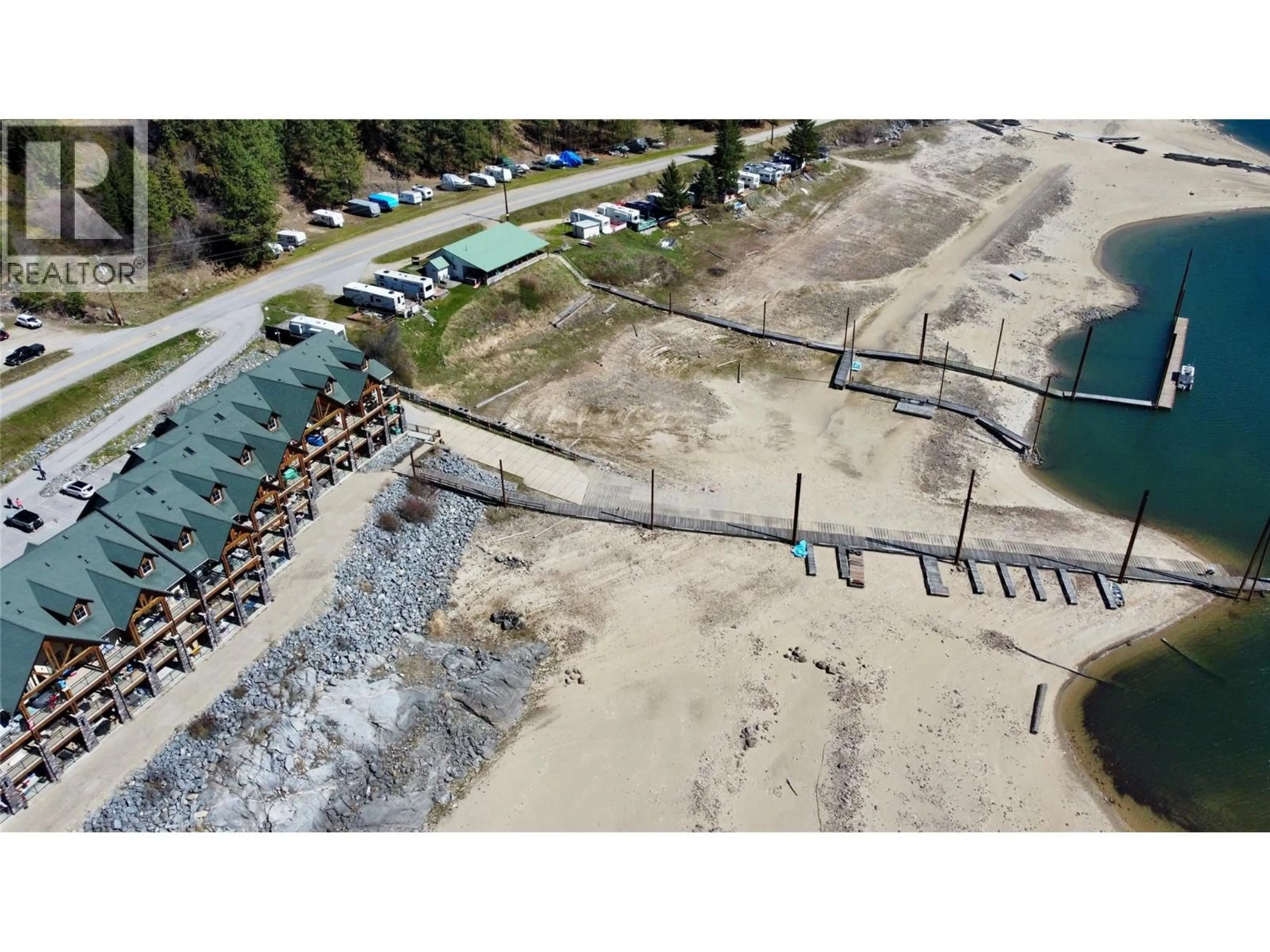 A pic from outside/outdoor area/front of a property/back of a property/a pic from drone, water/lake/river/ocean view for 109 - 5570 BROADWATER ROAD, Castlegar British Columbia V1N0A1