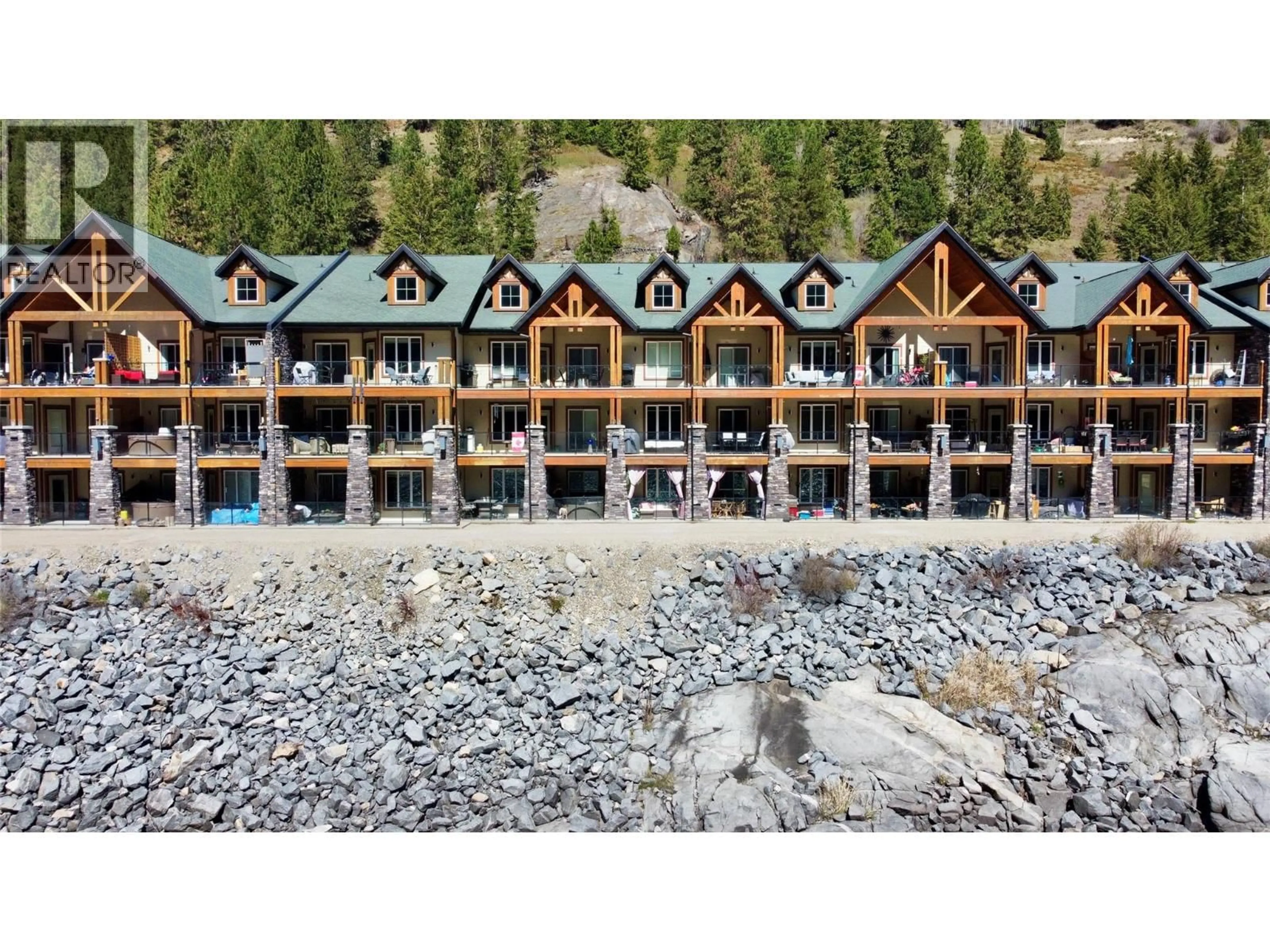 A pic from outside/outdoor area/front of a property/back of a property/a pic from drone, water/lake/river/ocean view for 109 - 5570 BROADWATER ROAD, Castlegar British Columbia V1N0A1