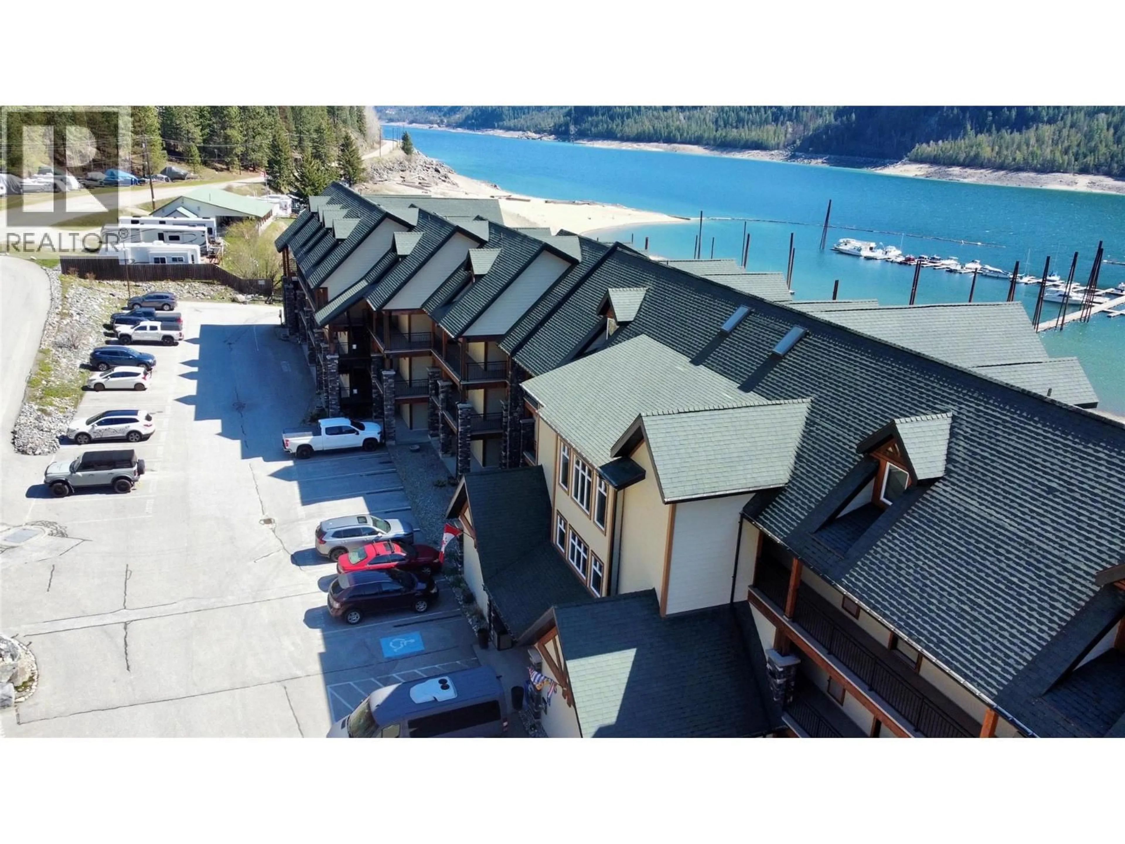 A pic from outside/outdoor area/front of a property/back of a property/a pic from drone, water/lake/river/ocean view for 109 - 5570 BROADWATER ROAD, Castlegar British Columbia V1N0A1