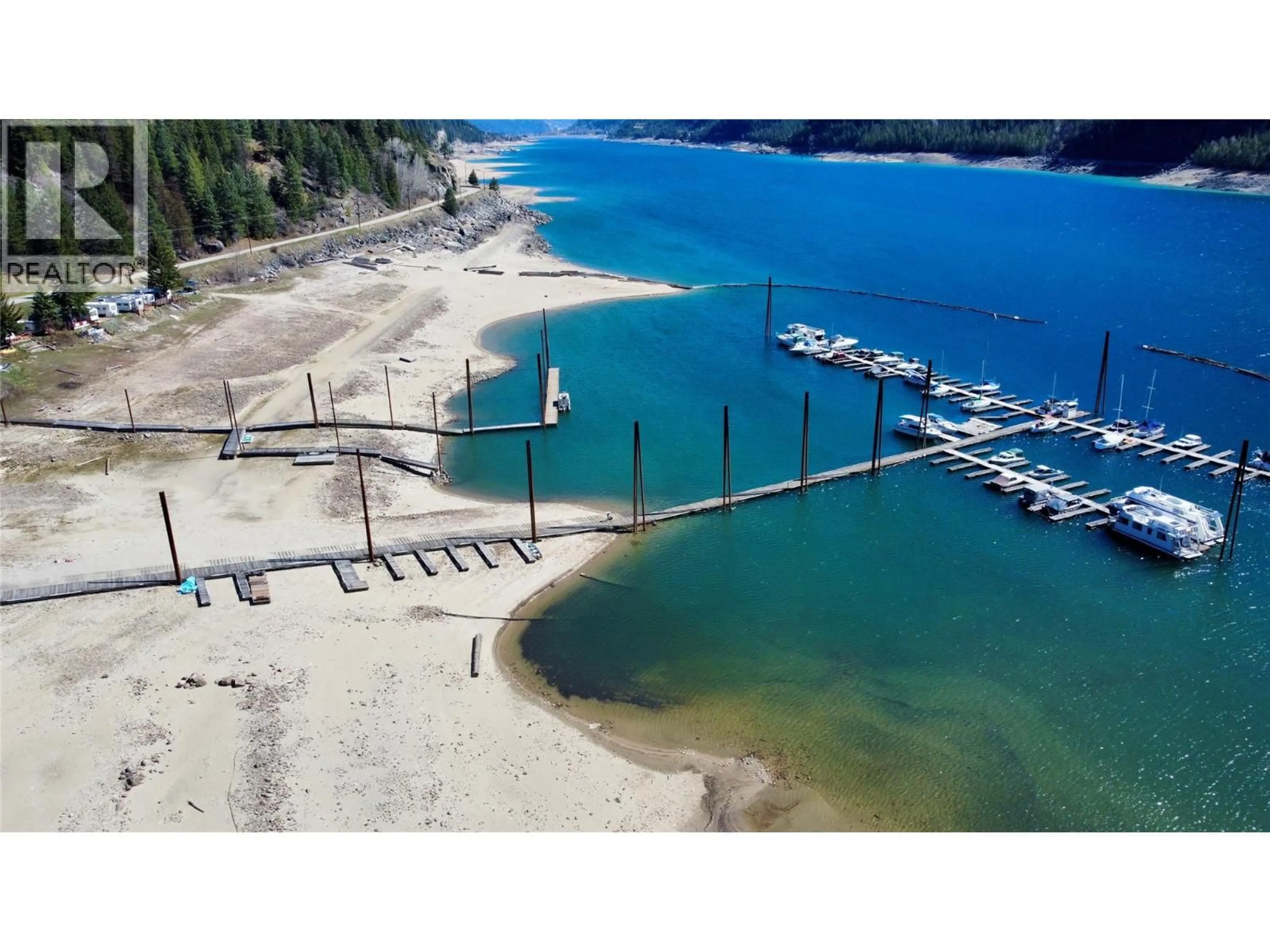 A pic from outside/outdoor area/front of a property/back of a property/a pic from drone, water/lake/river/ocean view for 109 - 5570 BROADWATER ROAD, Castlegar British Columbia V1N0A1