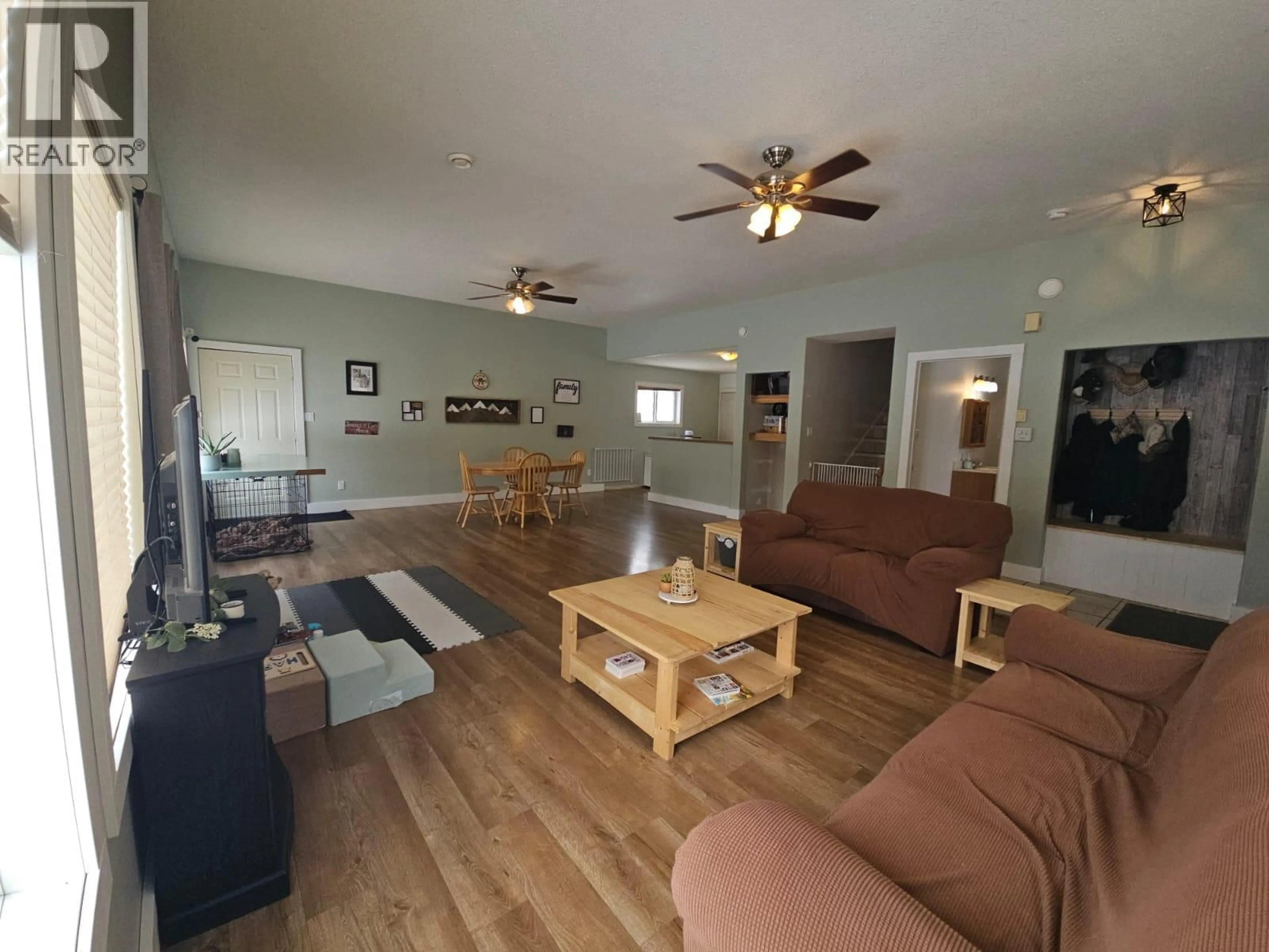 Living room with furniture, wood/laminate floor for 5746 97 HIGHWAY, Dawson Creek British Columbia V1G0J3