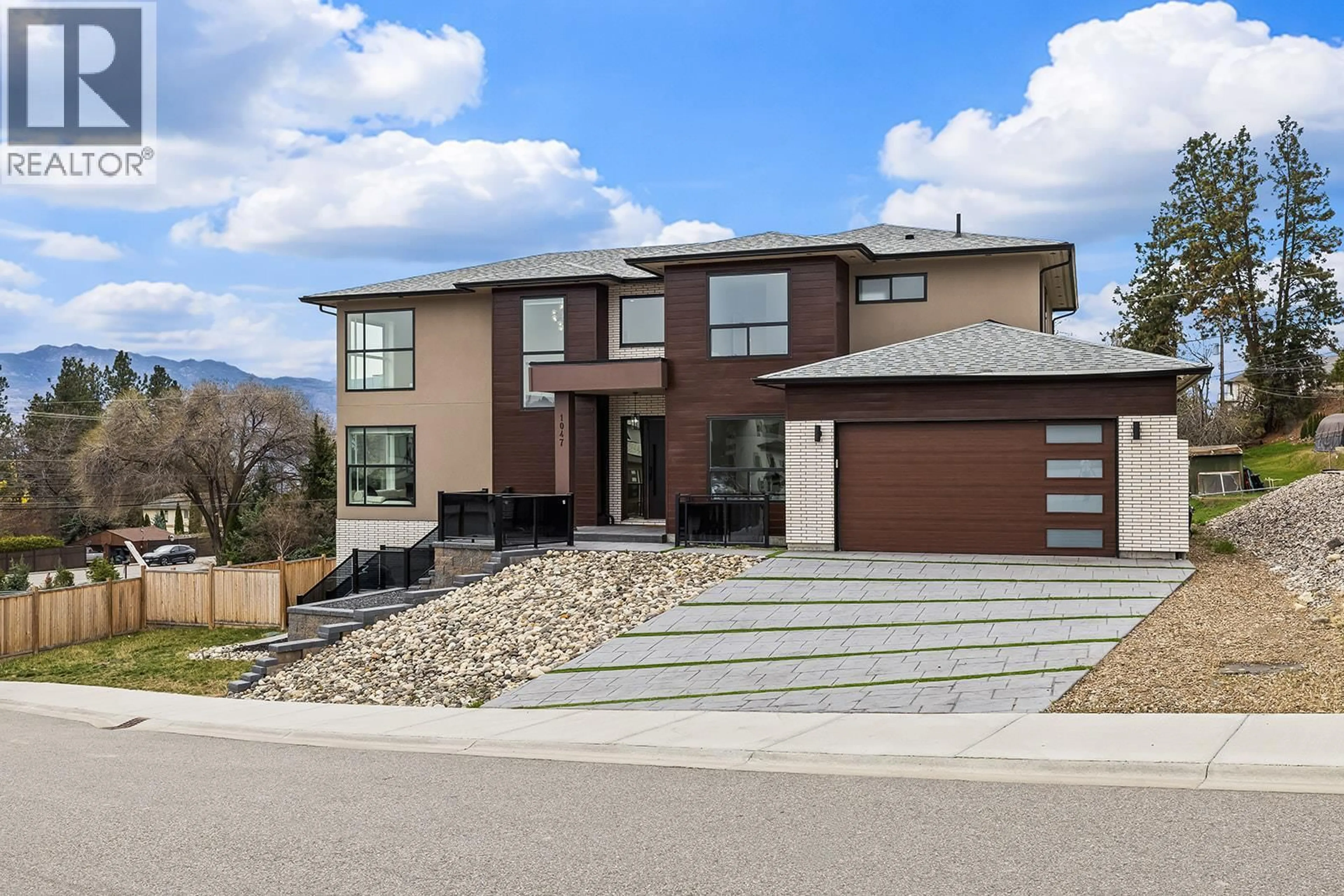Home with brick exterior material, street for 1047 OAK BARREL PLACE, West Kelowna British Columbia V1Z2G9