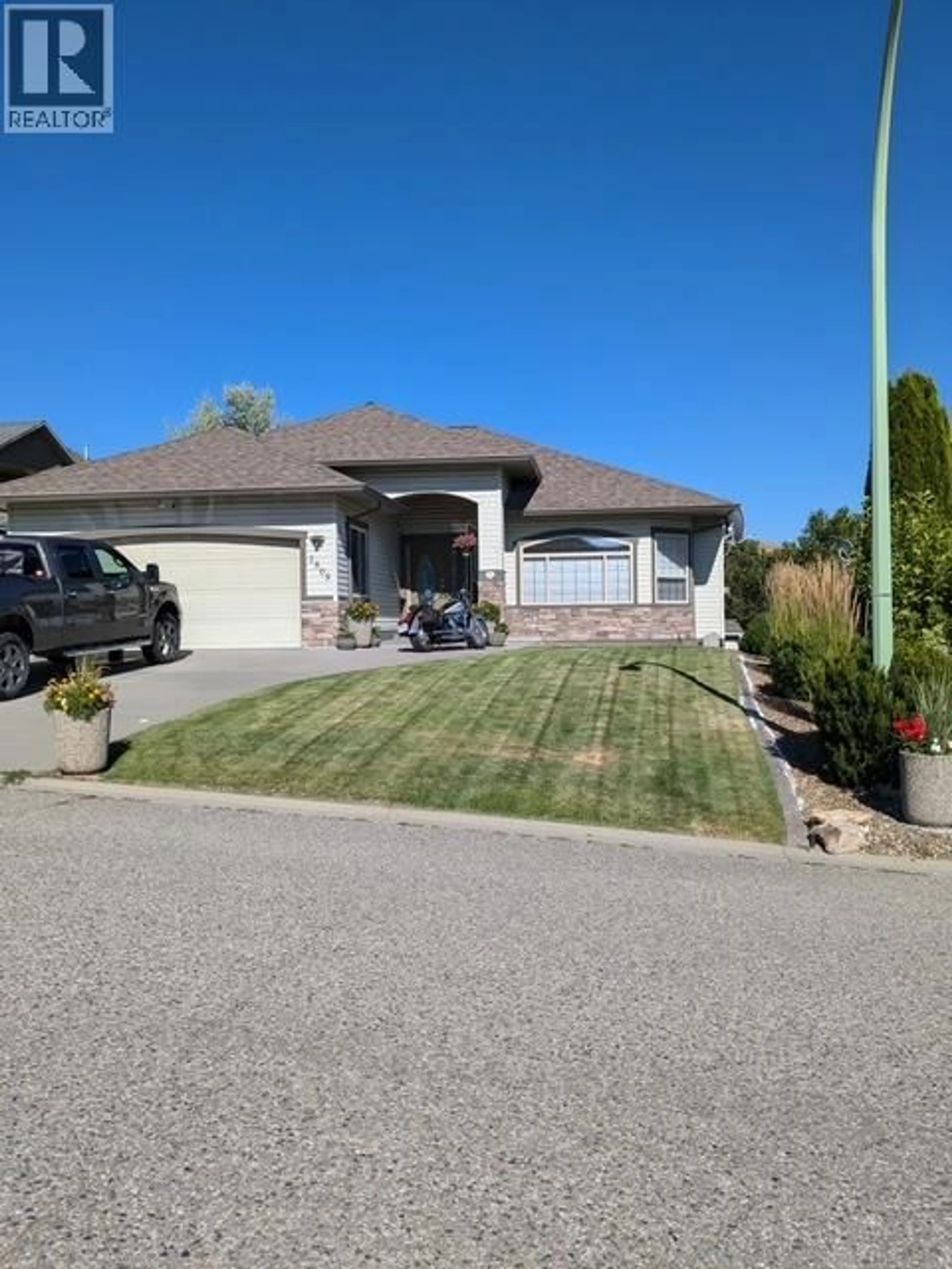 A pic from outside/outdoor area/front of a property/back of a property/a pic from drone, street for 1505 TANEMURA CRESCENT, Kelowna British Columbia V1P1N8