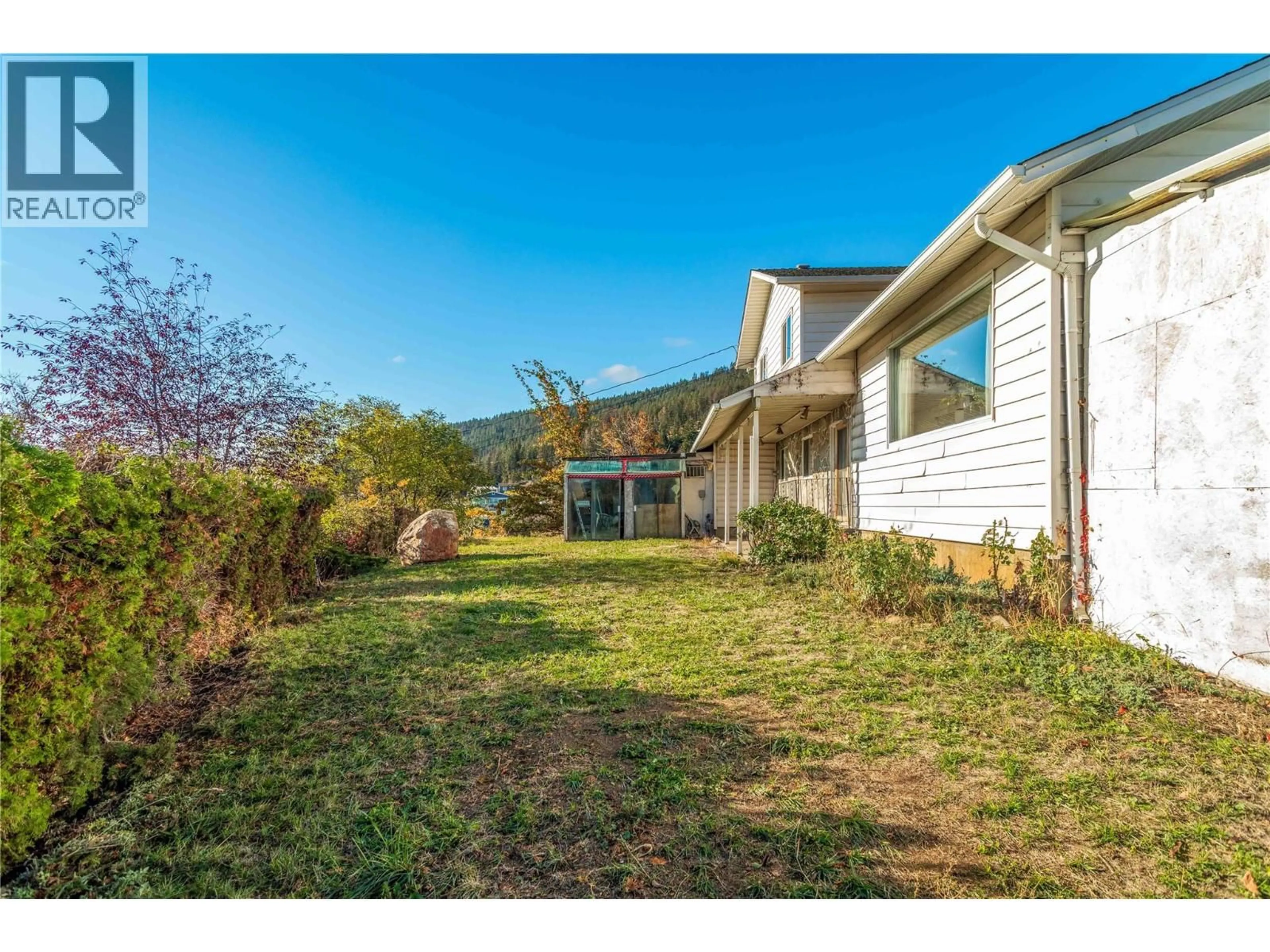 A pic from outside/outdoor area/front of a property/back of a property/a pic from drone, mountain view for 15370 OLD MISSION ROAD, Lake Country British Columbia V4V2G5