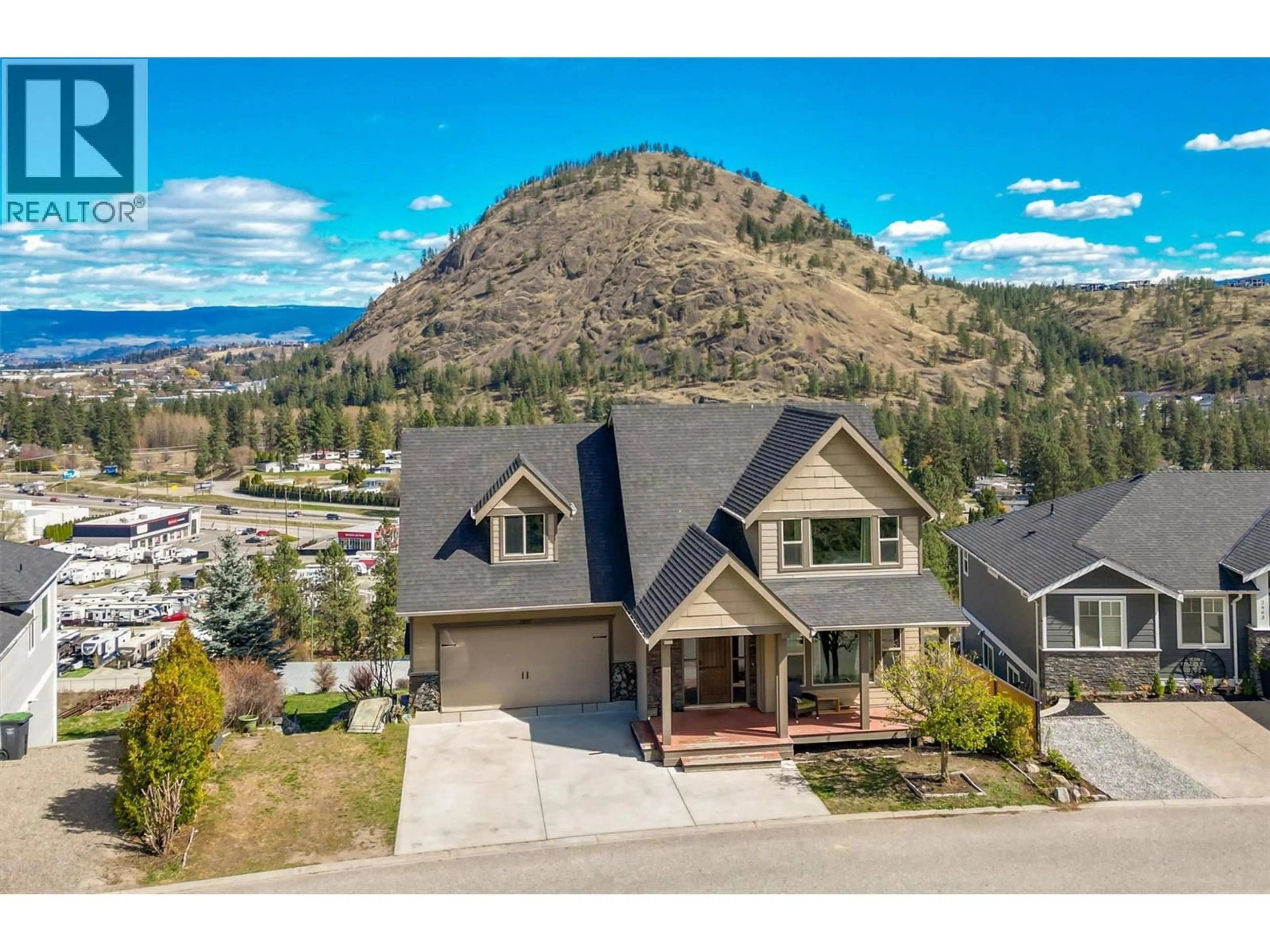 A pic from outside/outdoor area/front of a property/back of a property/a pic from drone, mountain view for 2957 ENSIGN LANE, West Kelowna British Columbia V4T2Z4
