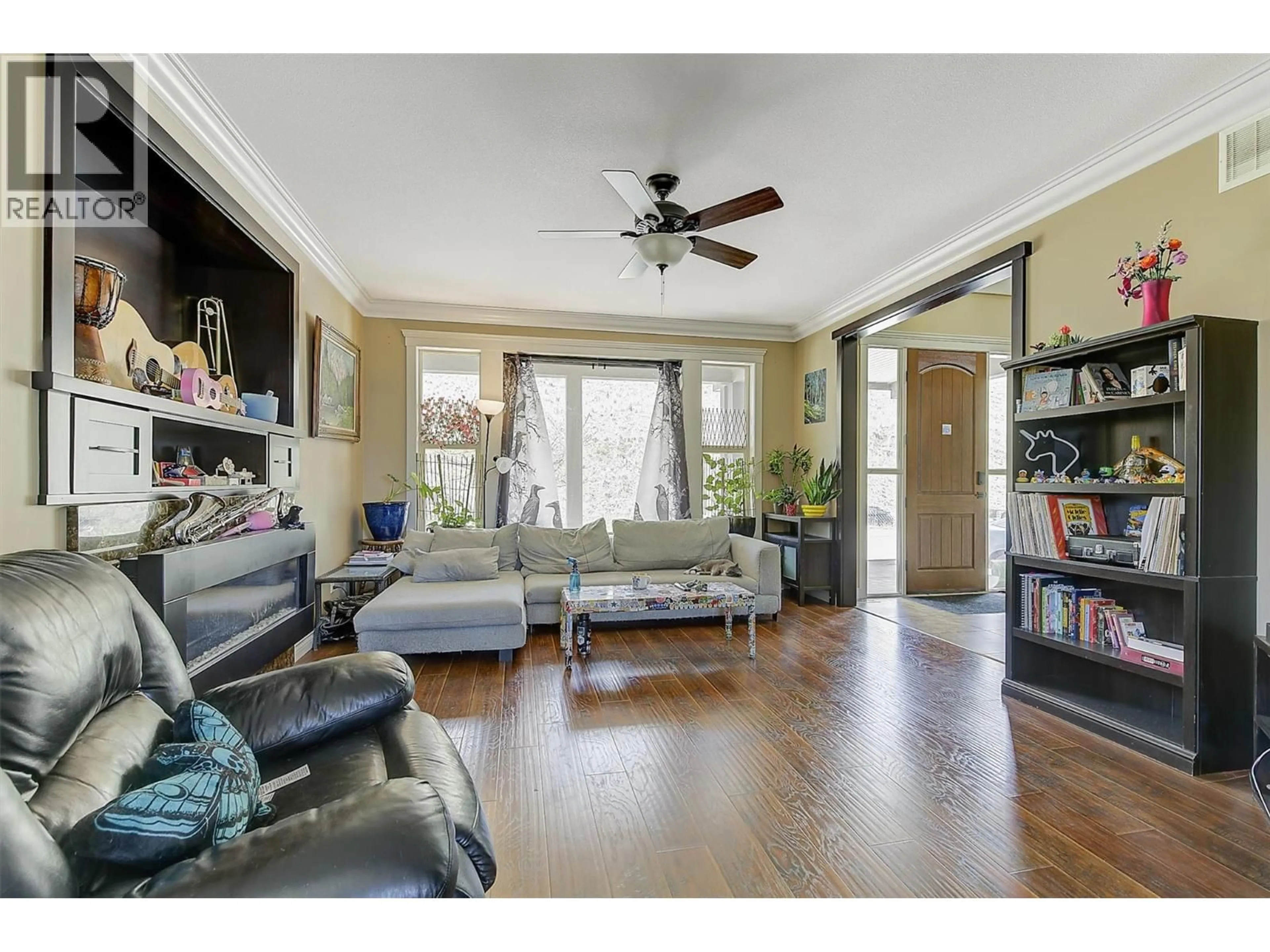 Living room with furniture, wood/laminate floor for 2957 ENSIGN LANE, West Kelowna British Columbia V4T2Z4