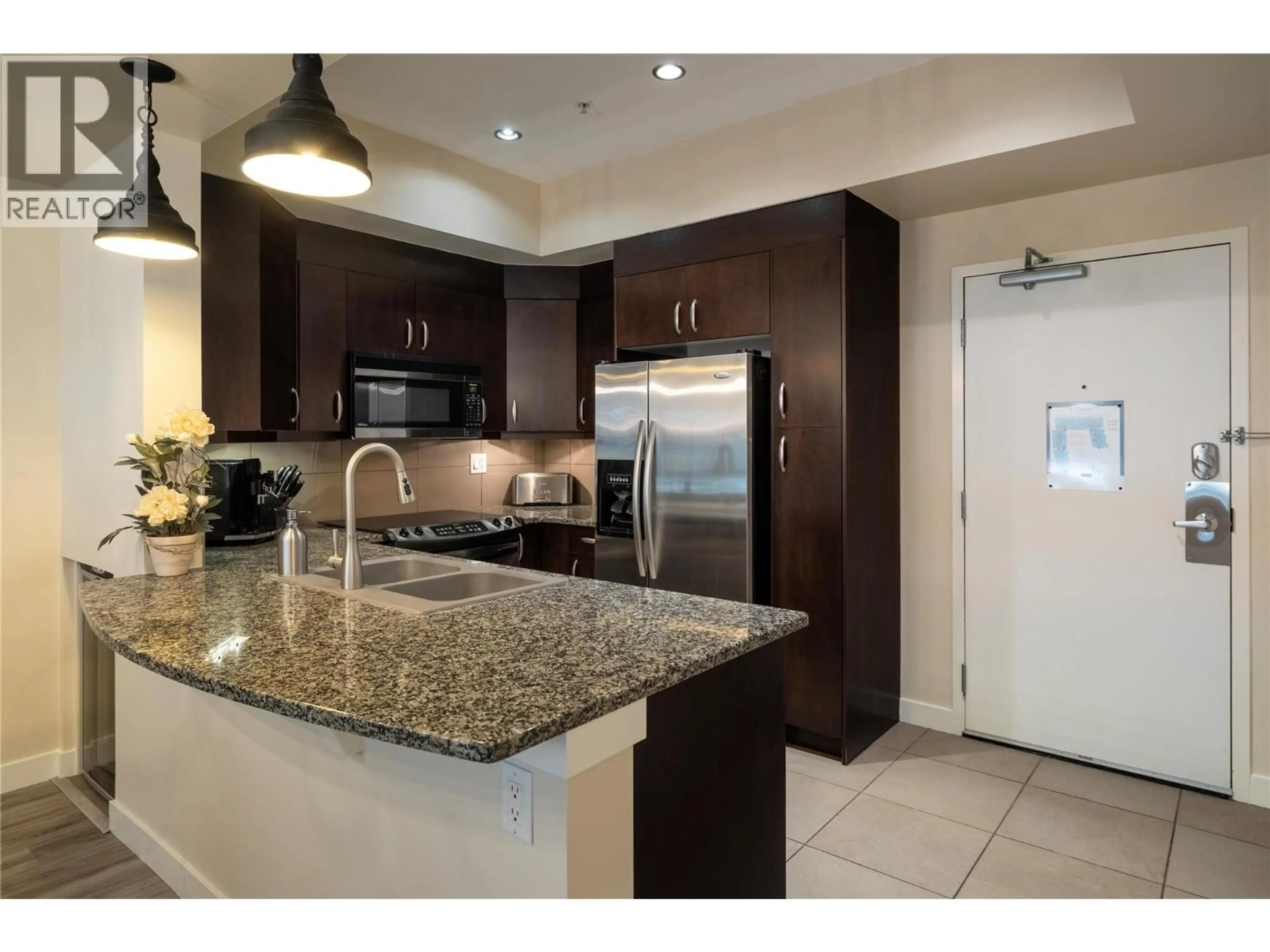 Open concept kitchen, ceramic/tile floor for 1130 - 7343 OKANAGAN LANDING ROAD, Vernon British Columbia V1H2J6