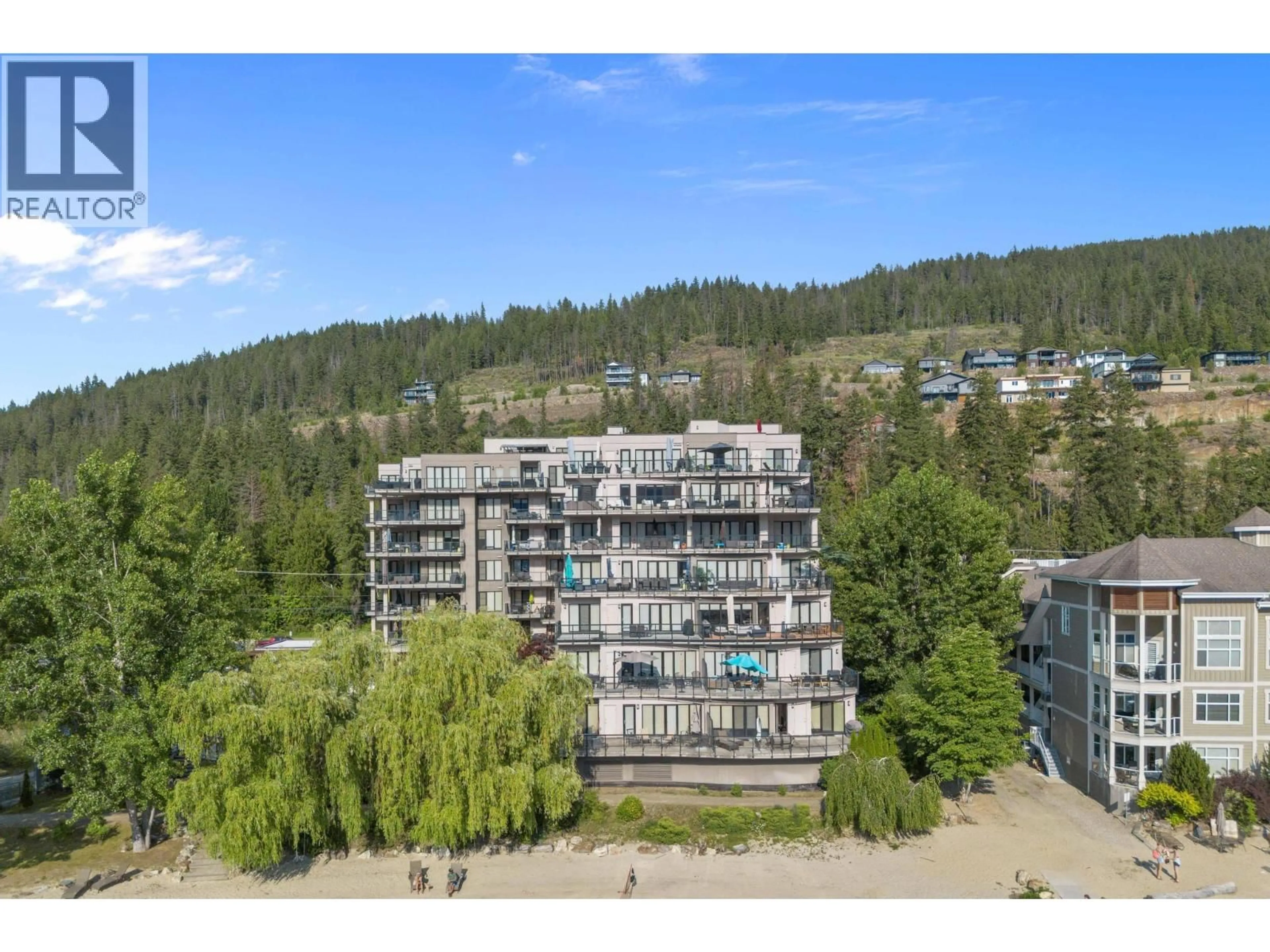 A pic from outside/outdoor area/front of a property/back of a property/a pic from drone, water/lake/river/ocean view for 703 - 326 MARA LAKE LANE, Sicamous British Columbia V0E2V1