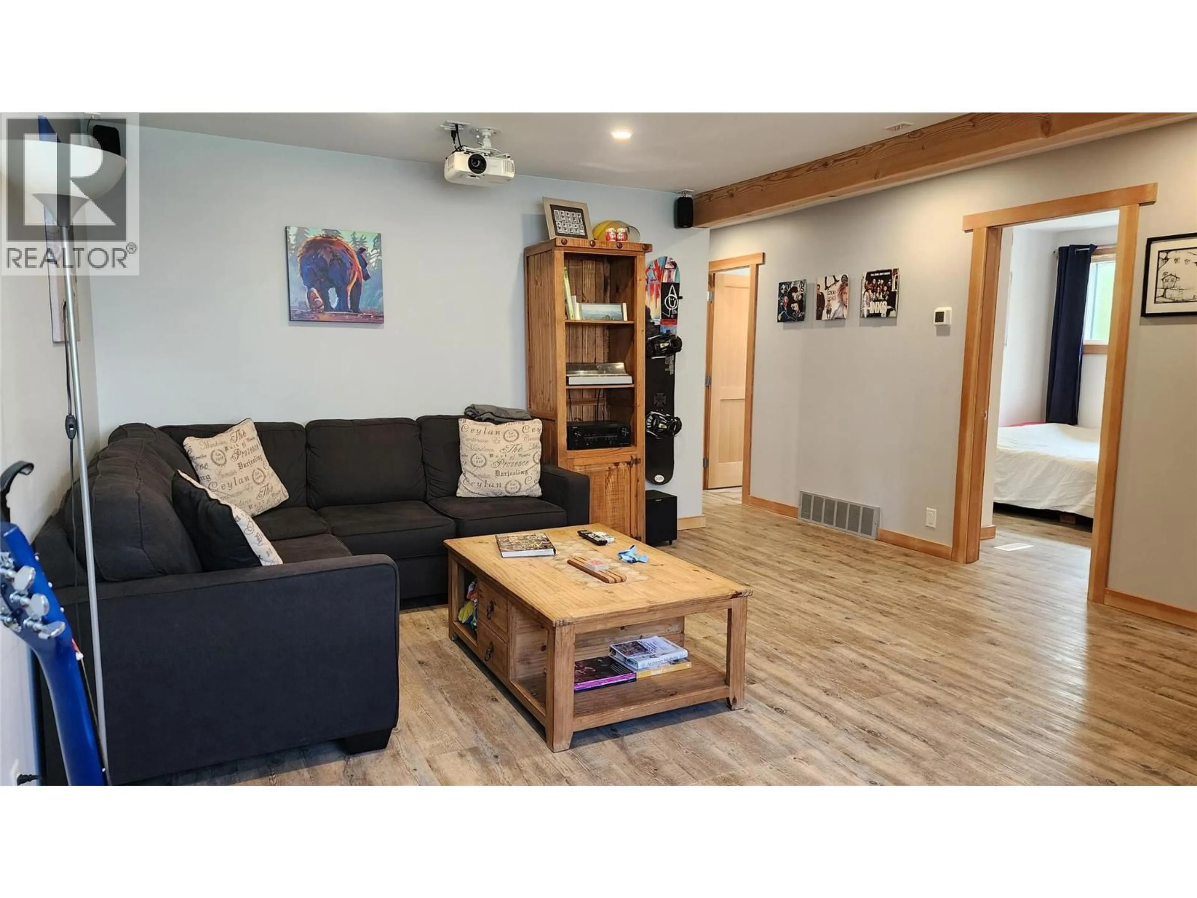 Living room with furniture, wood/laminate floor for 1675 LEROI AVENUE, Rossland British Columbia V0G1Y0