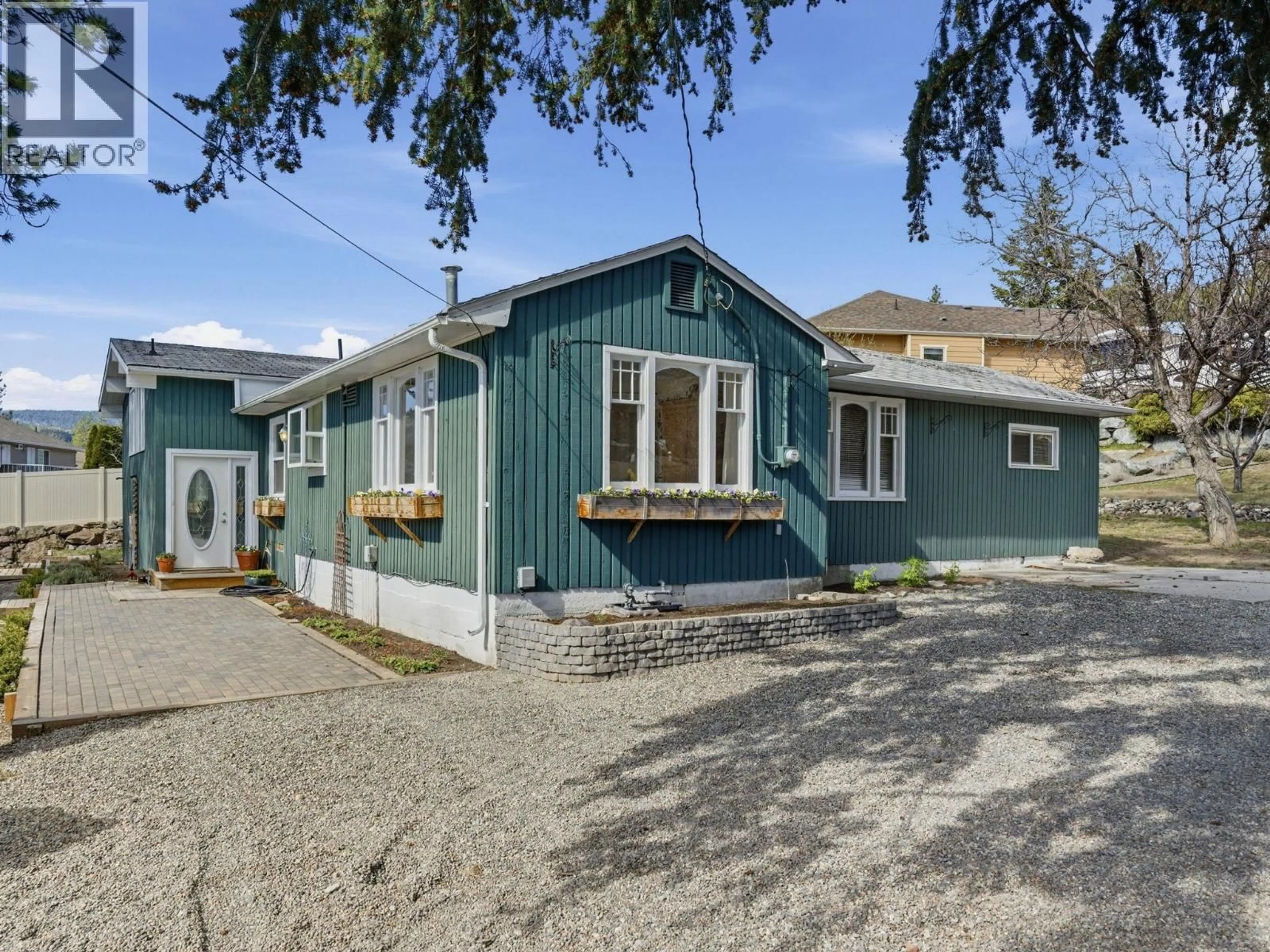 Home with vinyl exterior material, street for 3090 SMITH CREEK ROAD, West Kelowna British Columbia V4T1M8