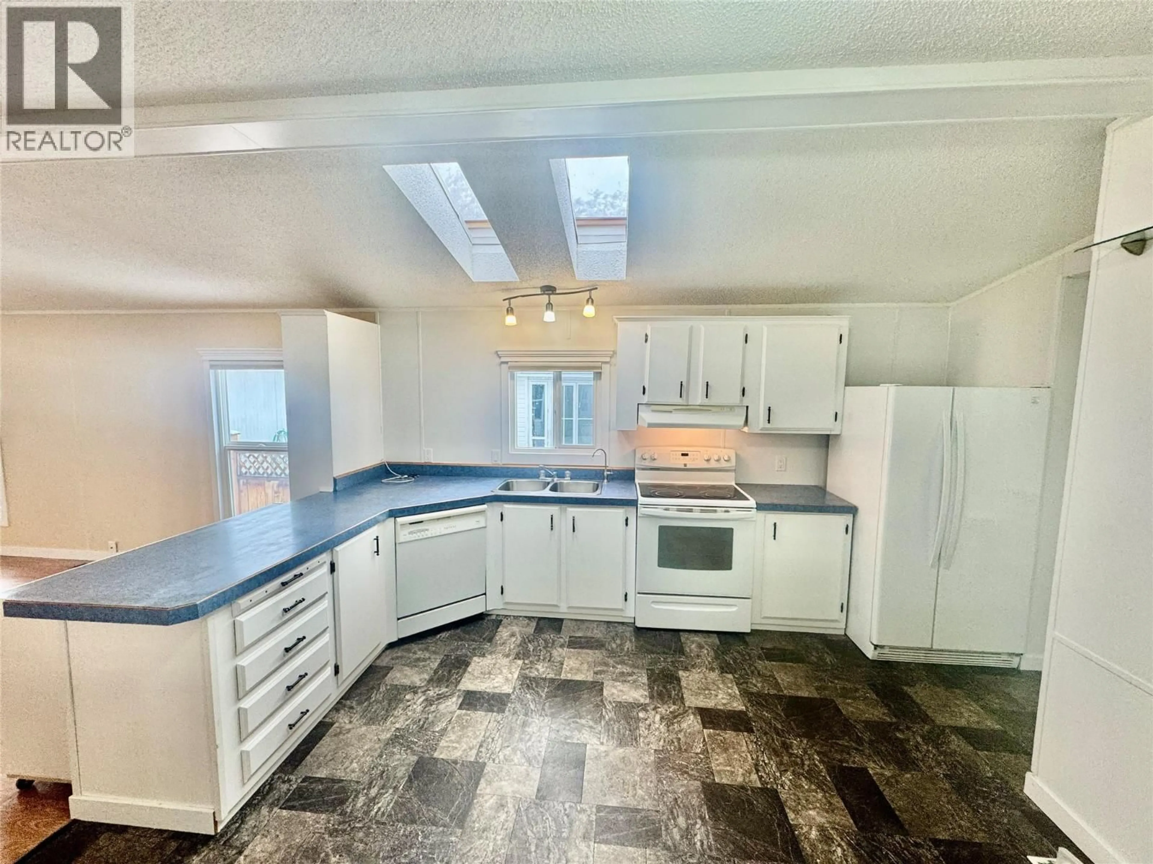 Open concept kitchen, ceramic/tile floor for 135 - 720 COMMONWEALTH ROAD, Kelowna British Columbia V4V1R8
