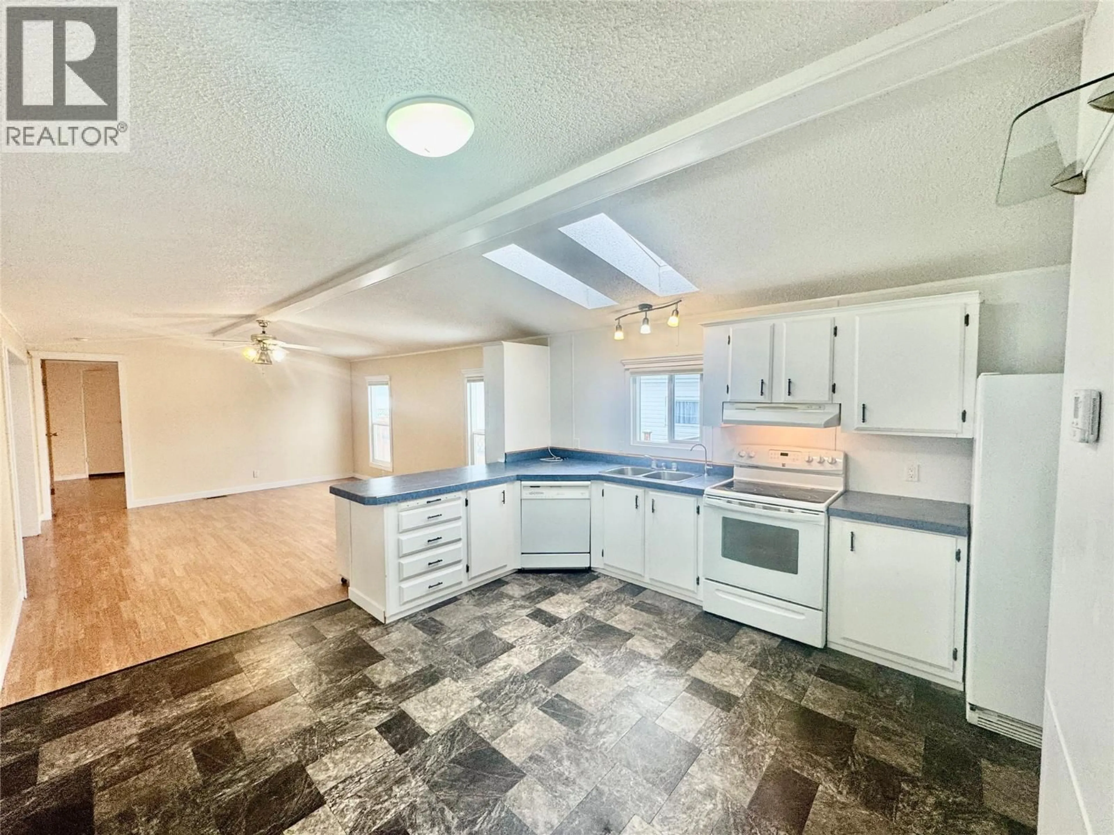 Open concept kitchen, ceramic/tile floor for 135 - 720 COMMONWEALTH ROAD, Kelowna British Columbia V4V1R8