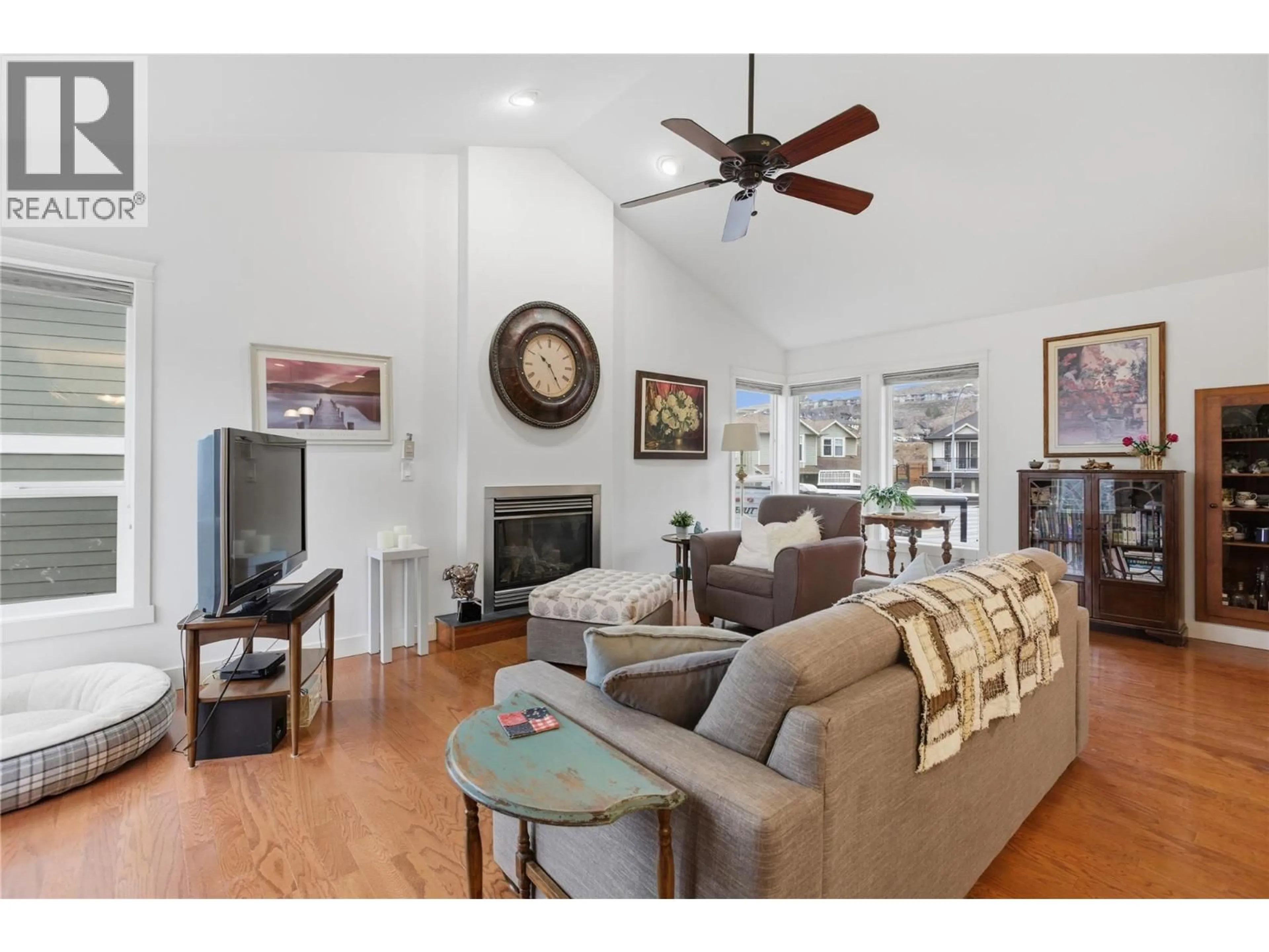 Living room with furniture, wood/laminate floor for 2150 CANTLE PLACE, Kamloops British Columbia V2B0A7