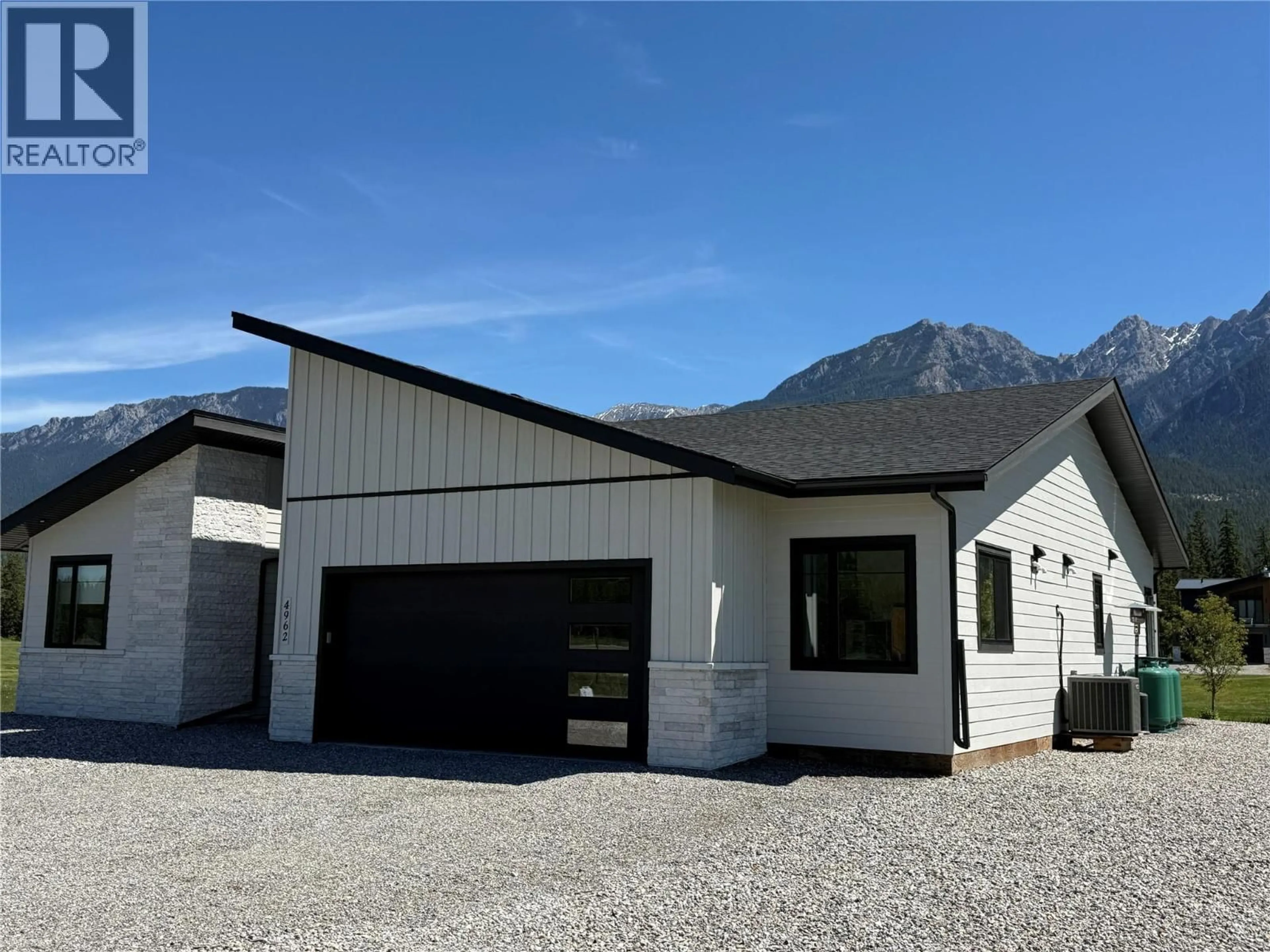 Home with vinyl exterior material, mountain view for 4962 RIVERSIDE DRIVE, Fairmont Hot Springs British Columbia V0B1L1