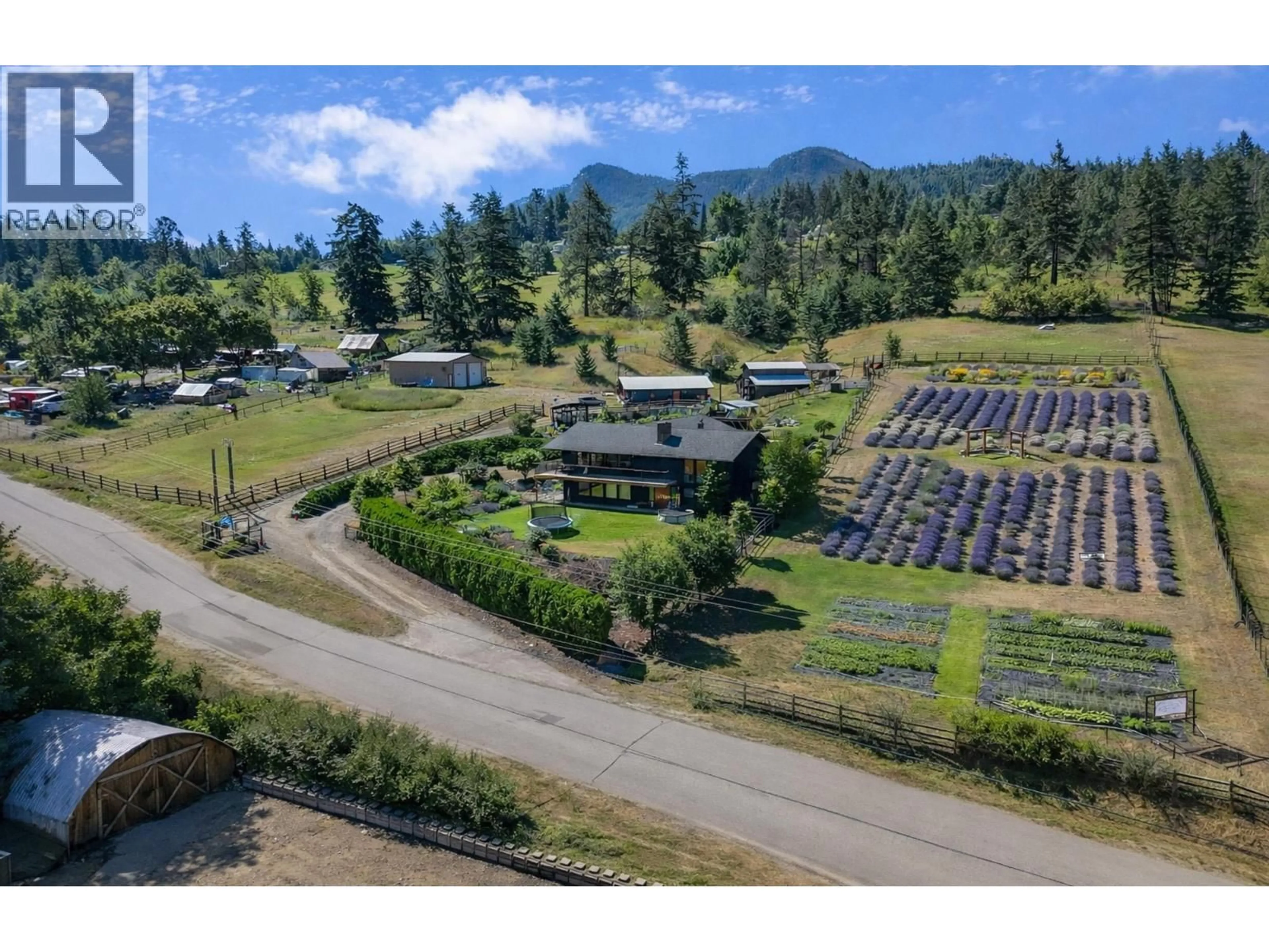 A pic from outside/outdoor area/front of a property/back of a property/a pic from drone, mountain view for 5770 LEARMOUTH ROAD, Coldstream British Columbia V1B3E6