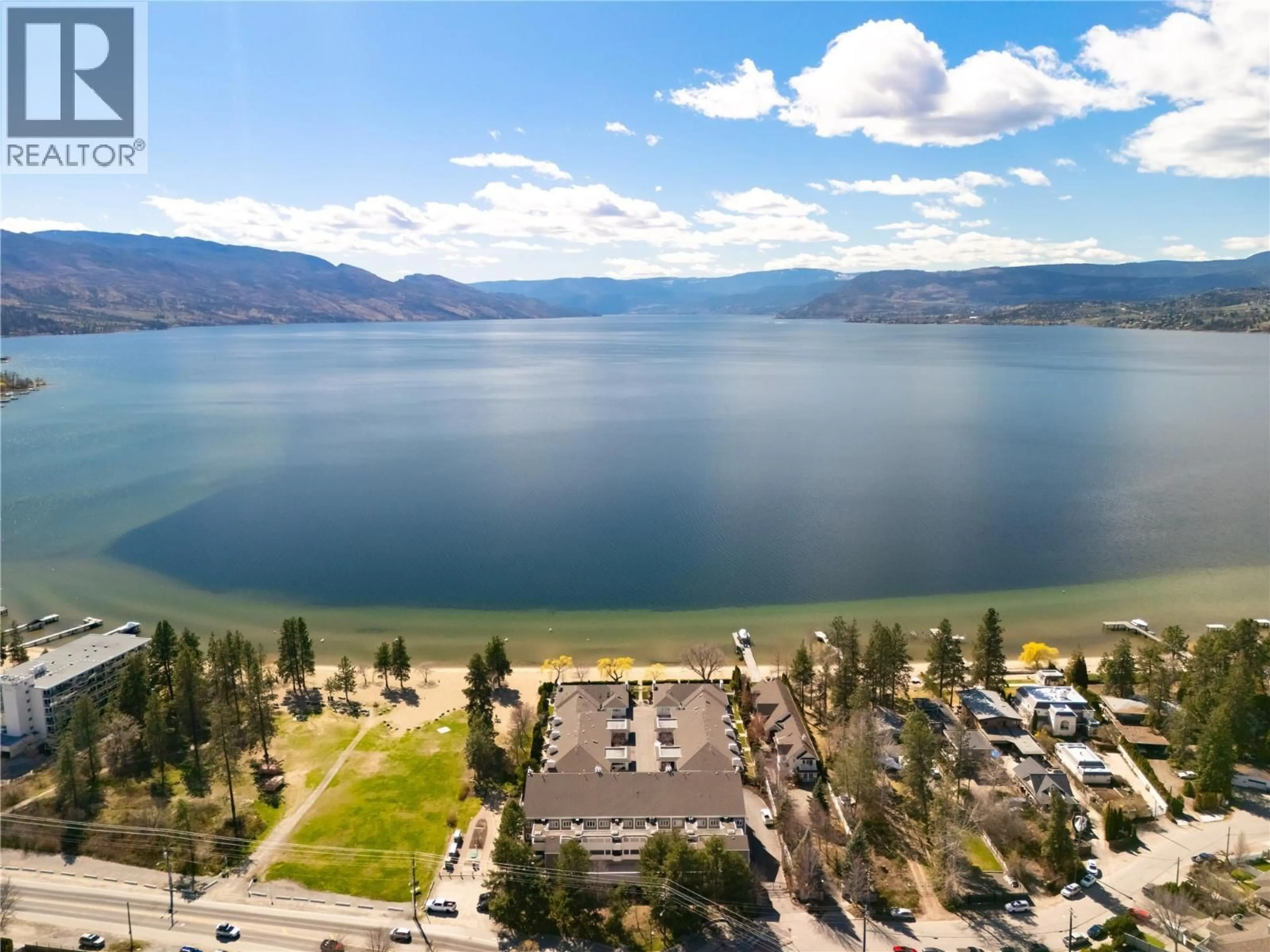 A pic from outside/outdoor area/front of a property/back of a property/a pic from drone, water/lake/river/ocean view for 305 - 4004 BLUEBIRD ROAD, Kelowna British Columbia V1W1X6