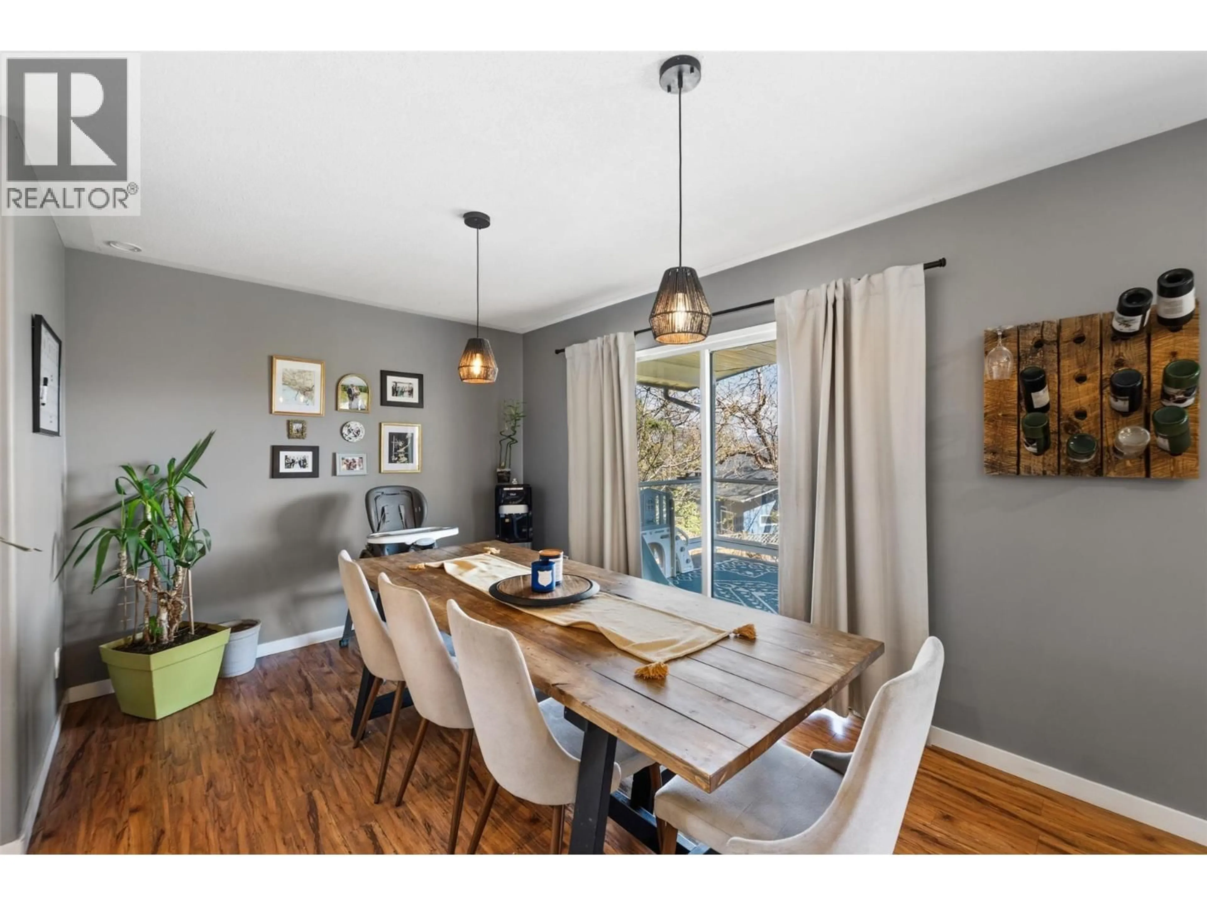 Dining room, wood/laminate floor for 3853 GLENWAY ROAD, West Kelowna British Columbia V4T1C9