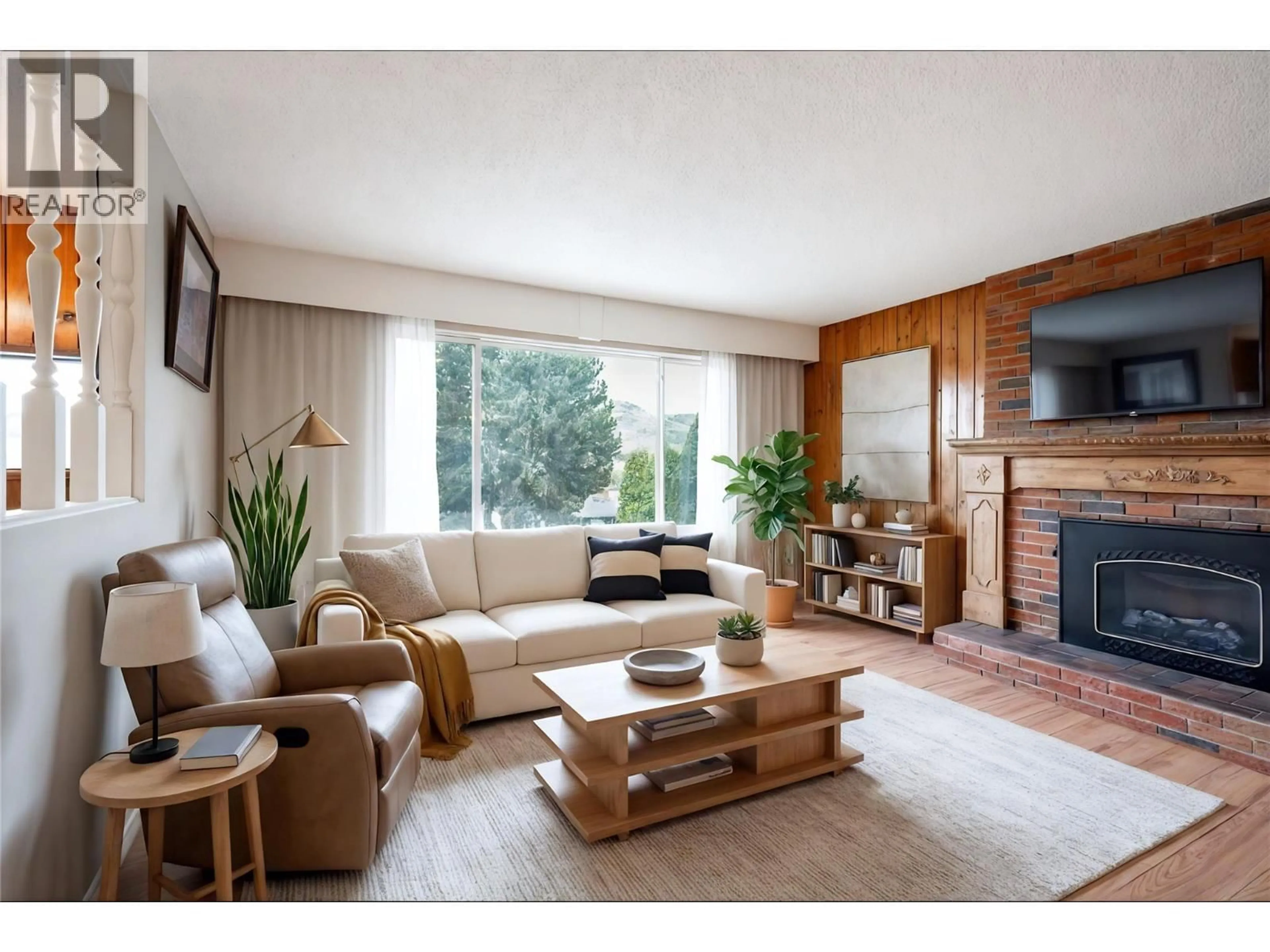 Living room with furniture, wood/laminate floor for 11506 BRIAR DRIVE, Coldstream British Columbia V1B2A5