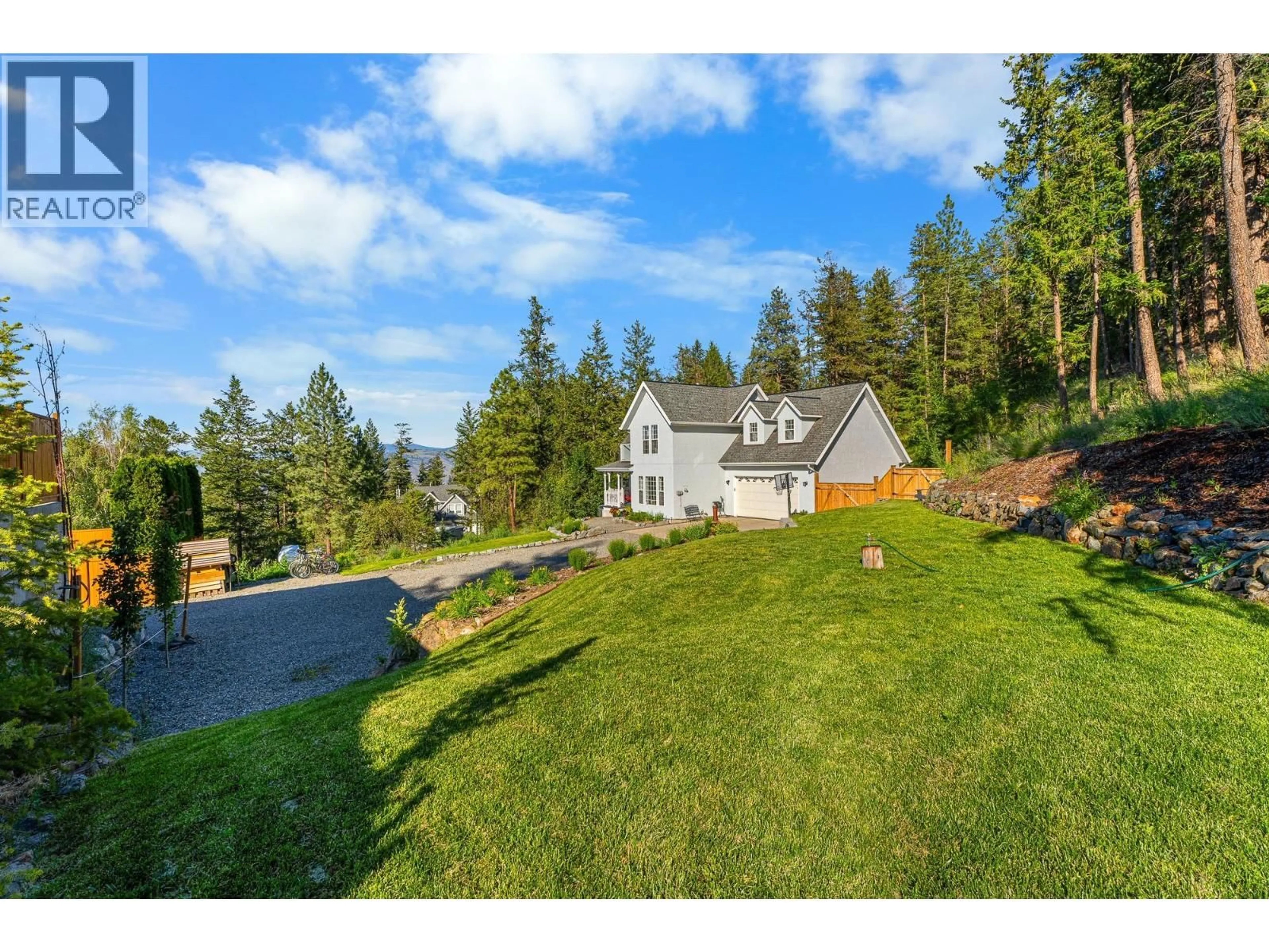 A pic from outside/outdoor area/front of a property/back of a property/a pic from drone, mountain view for 2079 GLENMOHR DRIVE, Kamloops British Columbia V1S1N4