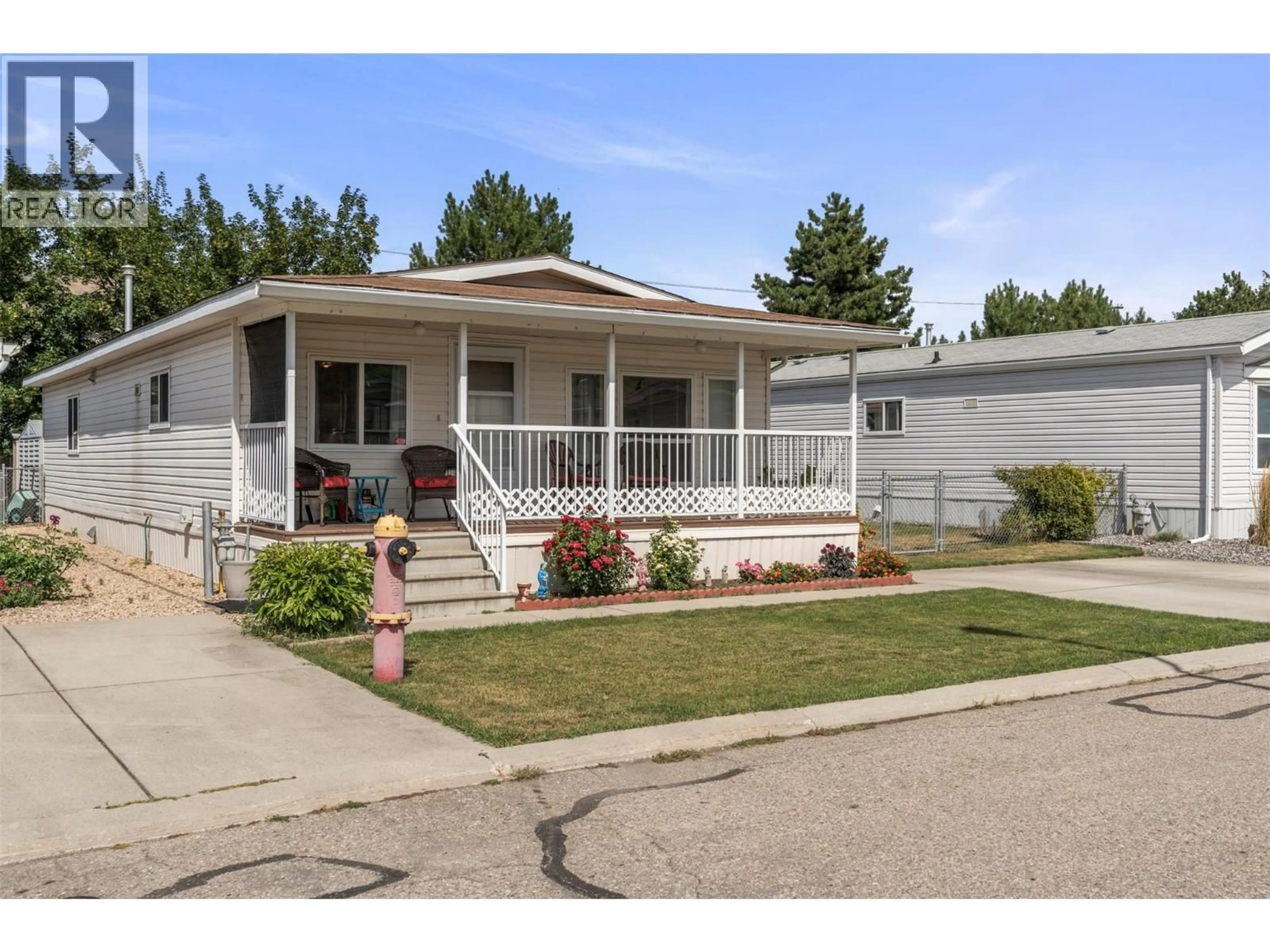 Home with vinyl exterior material, street for 9 - 6688 TRONSON ROAD, Vernon British Columbia V1H1R9