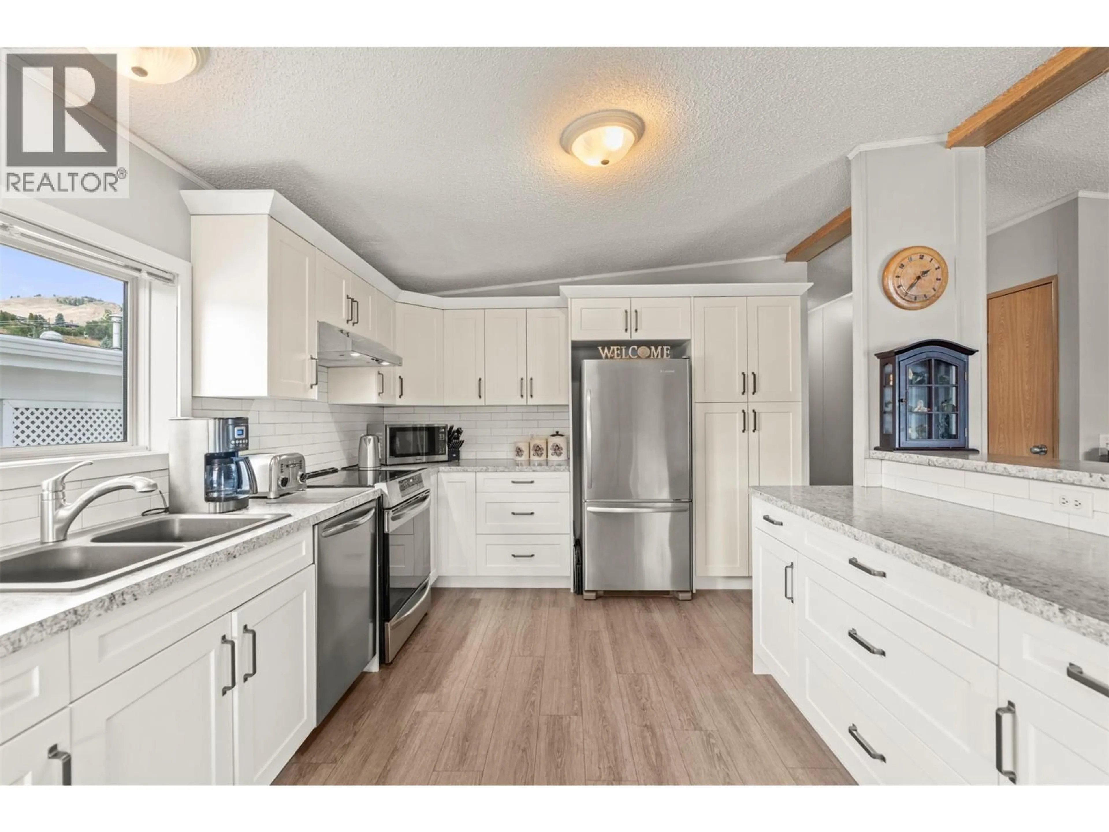 Open concept kitchen, unknown for 9 - 6688 TRONSON ROAD, Vernon British Columbia V1H1R9