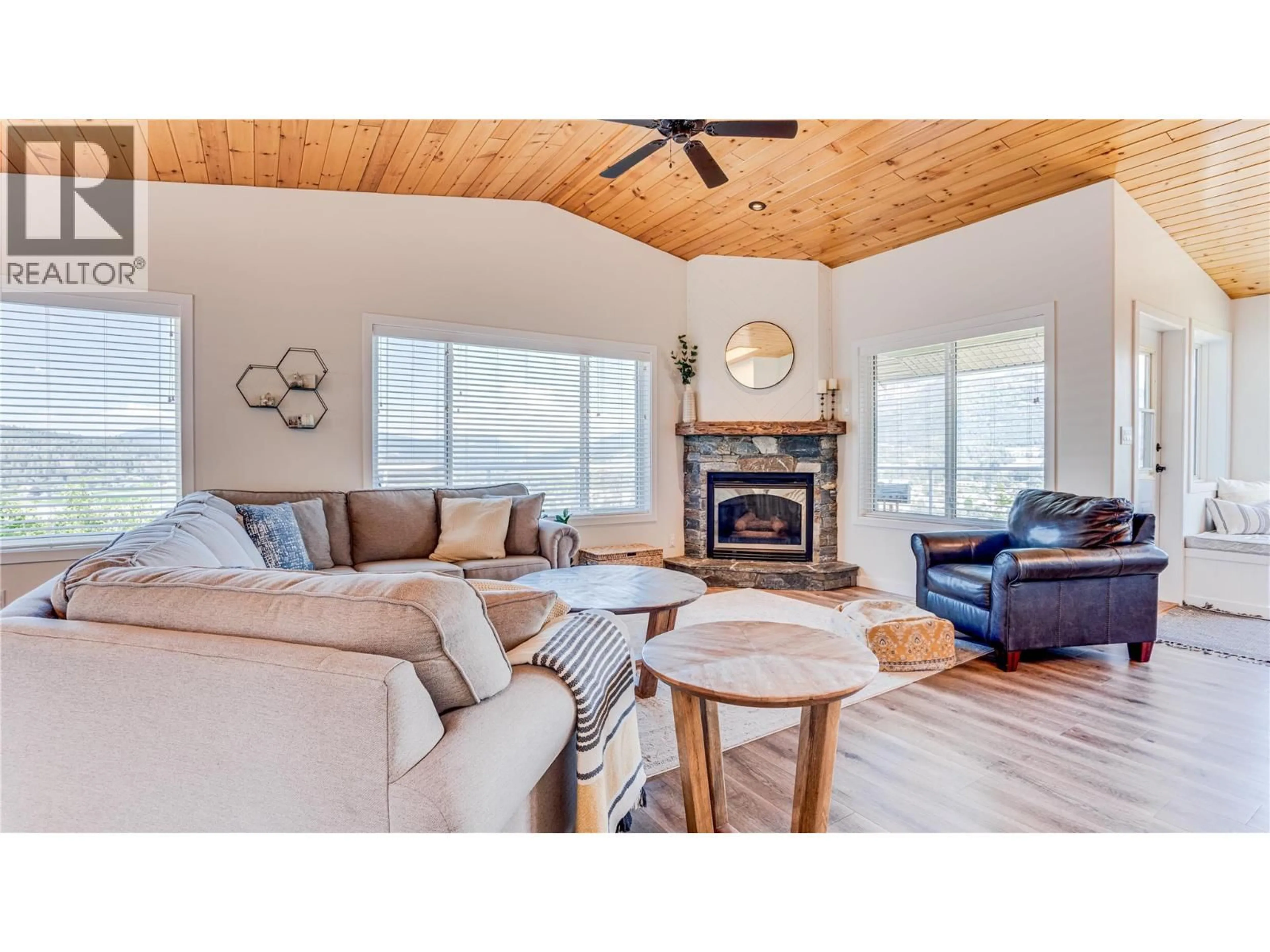 Living room with furniture, wood/laminate floor for 111 REVEL CRESCENT, Enderby British Columbia V4Y4B8