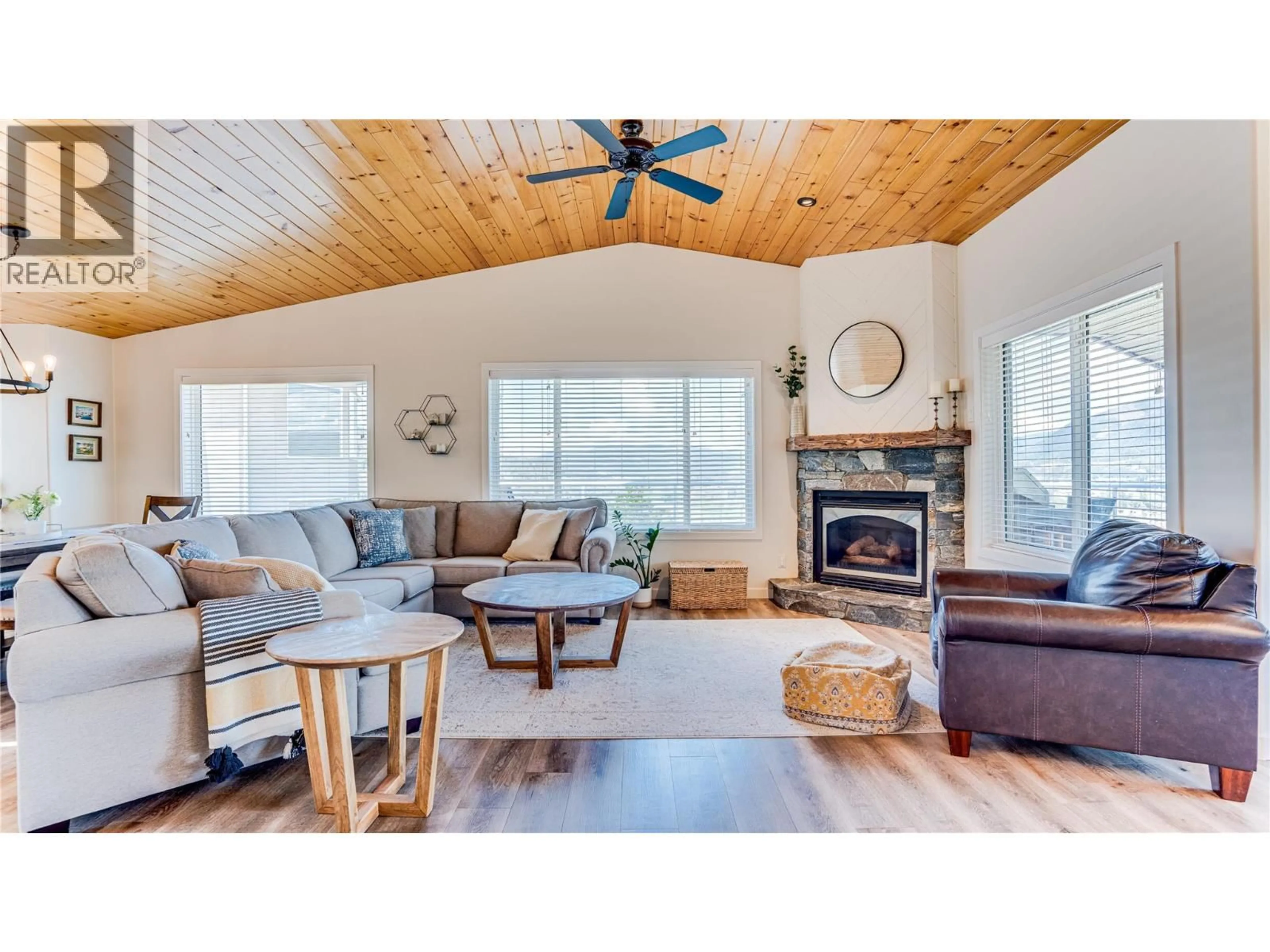 Living room with furniture, wood/laminate floor for 111 REVEL CRESCENT, Enderby British Columbia V4Y4B8