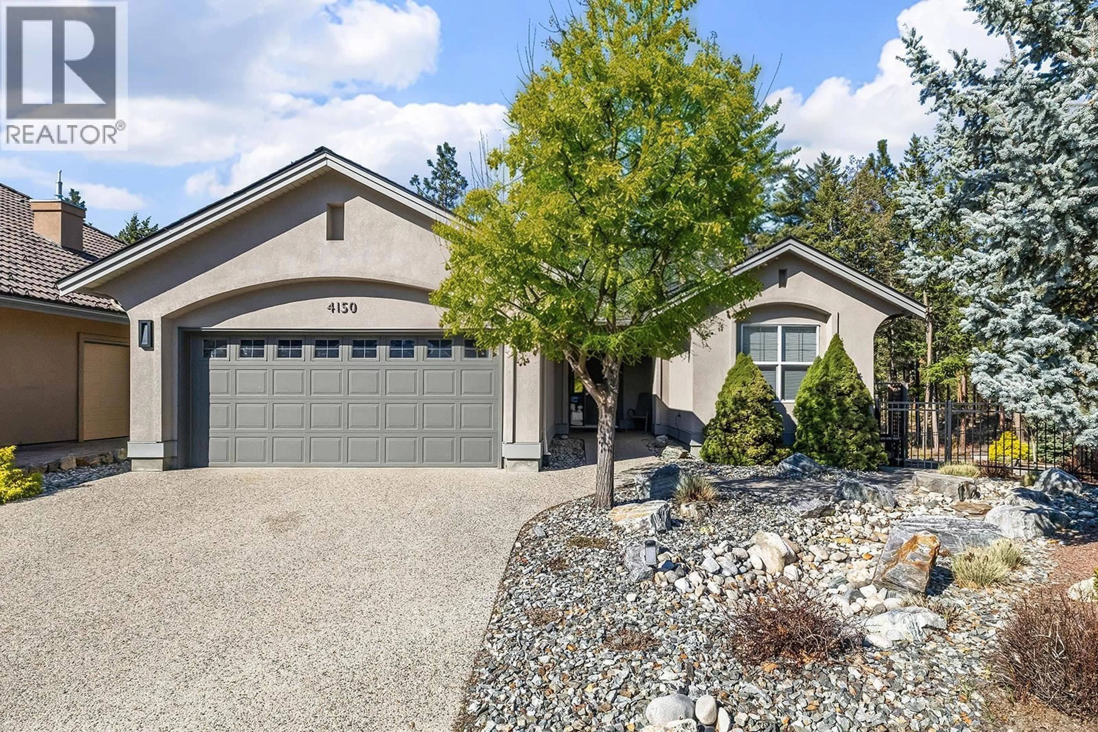 Home with vinyl exterior material, street for 4150 GALLAGHERS FOREST SOUTH, Kelowna British Columbia V1W5E4